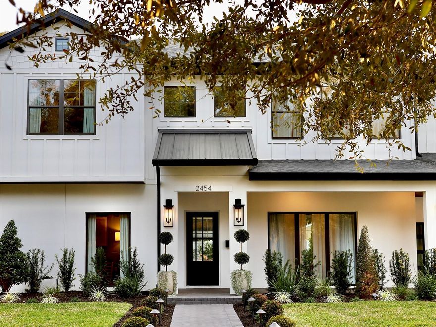 One or more photo(s) has been virtually staged. Would you move TOMORROW! Welcome to this aesthetic custom luxury home in an unbeatable Winter Park location.From the moment you arrive, the custom landscaping and automated lighting make a statement, day or night.At the center of the home, the chef's kitchen is both a showpiece and a performance space. A commanding 48-inch Z-Line gas range with 8 Italian-made brass burners anchors the room, complemented by Café luxury appliances, a stainless steel refrigerator, quartz countertops, and custom cabinetry. The walk-in pantry with floating shelves and under-shelf lighting adds both beauty and function. An indoor wine bar with built-in cabinetry and wine refrigerator enhances the entertaining experience, while an upstairs beverage station keeps every level equally equipped.The primary suite is a full spa experience. The glass enclosed shower features a rain head, body jets, and handheld fixtures. A soaking tub, dual vanities with quartz counters, and a generously proportioned walk-in closet complete the retreat. Imported aged brass designer light fixtures are included in the sale. Philips Hue smart lighting synchronizes every indoor and outdoor light in one app, and a smart security camera system with fingerprint keypad entry completes the tech package.
The outdoor living experience rivals the interior. A covered lanai with a fully equipped summer kitchen, including a built-in grill, dedicated refrigerator, and generous prep space, flows into a landscaped courtyard designed with an Italian villa, Mediterranean feel. As evening falls, intentional landscape lighting transforms the grounds into an intimate setting perfect for al fresco dinners, fireside gatherings, or projecting the big game under the stars. Walk to pickleball courts, athletic fields, and a premier wellness facility. Park Avenue's celebrated boutiques and dining are just minutes away. New construction of this caliber is increasingly rare in Winter Park. Schedule your private showing today. The furniture and décor, curated by a professional design team, are negotiable, making it possible to move in with the full look already in place.