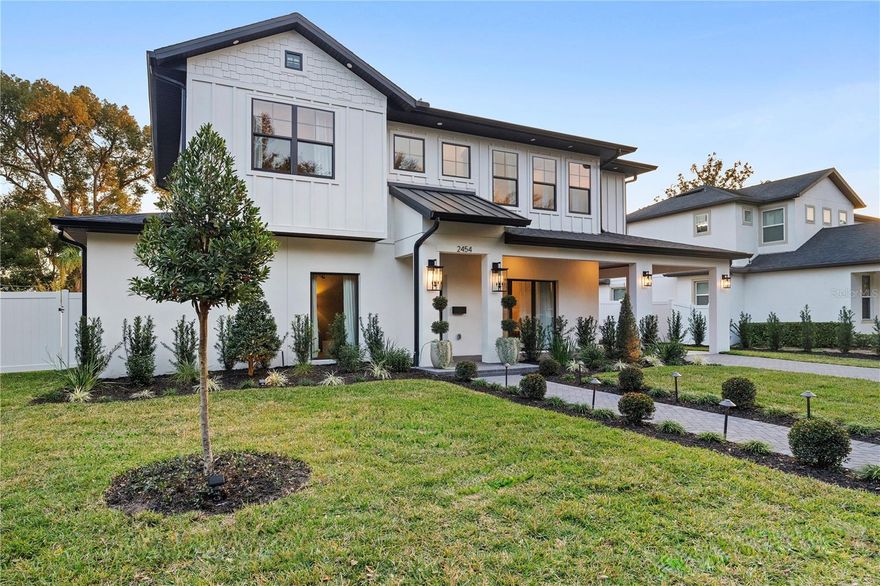 One or more photo(s) has been virtually staged. Would you move TOMORROW! Welcome to this aesthetic custom luxury home in an unbeatable Winter Park location.From the moment you arrive, the custom landscaping and automated lighting make a statement, day or night.At the center of the home, the chef's kitchen is both a showpiece and a performance space. A commanding 48-inch Z-Line gas range with 8 Italian-made brass burners anchors the room, complemented by Café luxury appliances, a stainless steel refrigerator, quartz countertops, and custom cabinetry. The walk-in pantry with floating shelves and under-shelf lighting adds both beauty and function. An indoor wine bar with built-in cabinetry and wine refrigerator enhances the entertaining experience, while an upstairs beverage station keeps every level equally equipped.The primary suite is a full spa experience. The glass enclosed shower features a rain head, body jets, and handheld fixtures. A soaking tub, dual vanities with quartz counters, and a generously proportioned walk-in closet complete the retreat. Imported aged brass designer light fixtures are included in the sale. Philips Hue smart lighting synchronizes every indoor and outdoor light in one app, and a smart security camera system with fingerprint keypad entry completes the tech package.
The outdoor living experience rivals the interior. A covered lanai with a fully equipped summer kitchen, including a built-in grill, dedicated refrigerator, and generous prep space, flows into a landscaped courtyard designed with an Italian villa, Mediterranean feel. As evening falls, intentional landscape lighting transforms the grounds into an intimate setting perfect for al fresco dinners, fireside gatherings, or projecting the big game under the stars. Walk to pickleball courts, athletic fields, and a premier wellness facility. Park Avenue's celebrated boutiques and dining are just minutes away. New construction of this caliber is increasingly rare in Winter Park. Schedule your private showing today. The furniture and décor, curated by a professional design team, are negotiable, making it possible to move in with the full look already in place.