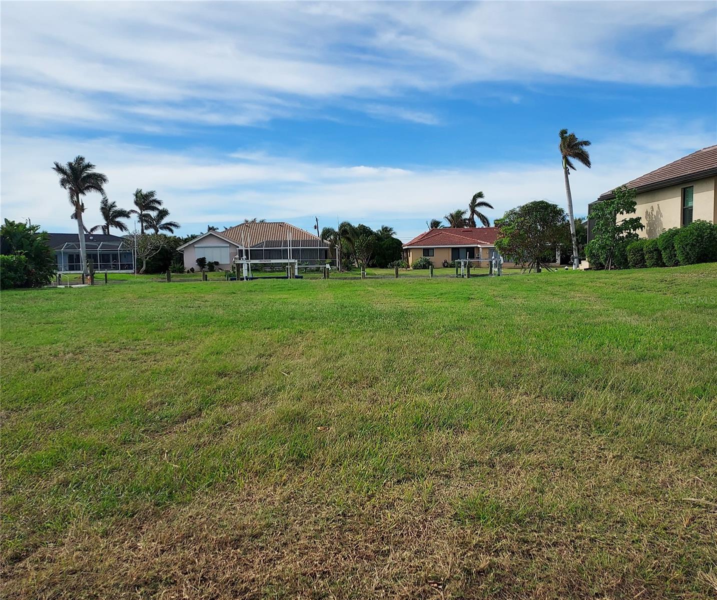 Fabulous Sailboat lot in beautiful Punta Gorda Isles. This lot is the 8th lot from open water for fast easy access whether you are going out for a day of fishing or leaving for an extended cruise this lot is the best you will find on the market today. A new 7' X 60' concrete dock is in place with a 16,000-pound boat lift You will have straight out access to Charlotte Harbor offering terrific sailing with access to the Gulf via Boca Grande. Fishing??? How about Redfish, Snook, Cobia, Tarpon, Seatrout and many other species. A run offshore will put you in Grouper waters. If you are looking for a great waterfront building site for your custom dream home, go take a look at this one.