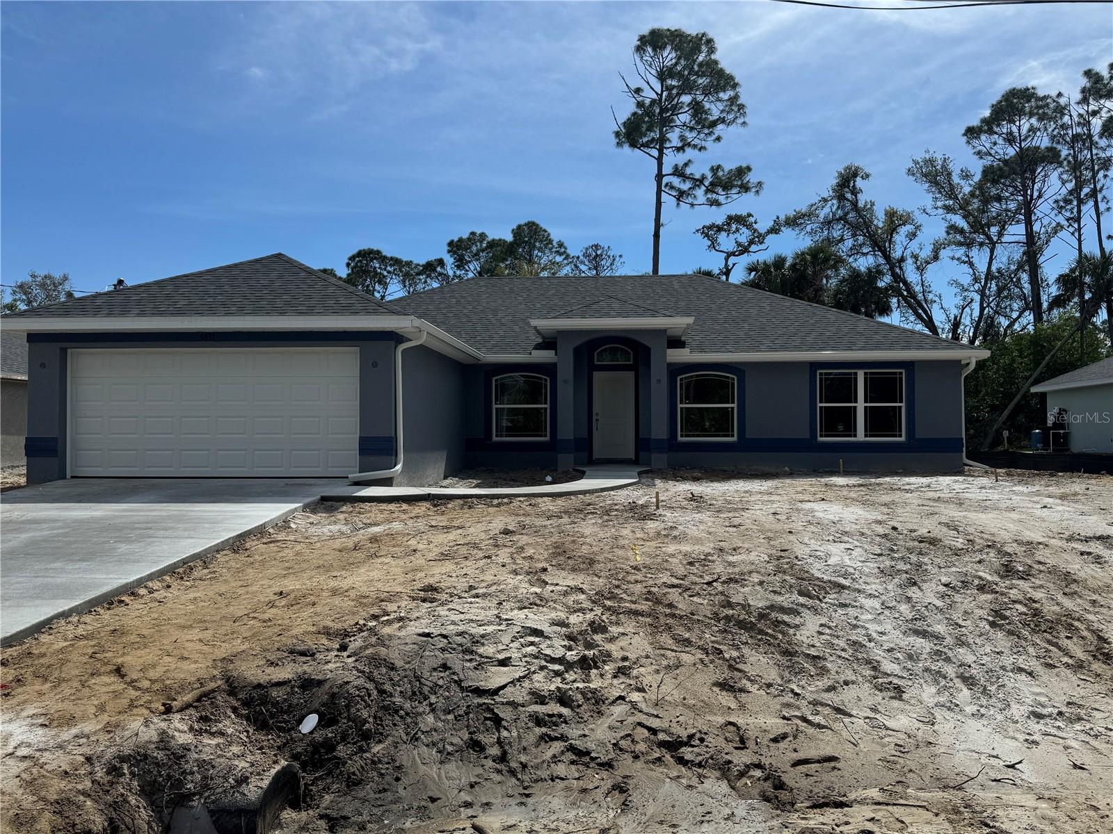 Under Construction. This charming North Port home offers the perfect blend of affordability and natural beauty. This property provides easy access to outdoor recreation, including kayaking on nearby waterways and enjoying the lush greenery of Myakka River State Park, and churches. This New Construction home has 1860 square feet of living space allowing you much room for your family as well as guests. The patio space gives you extra room for outdoor enjoyment. Adams Homes provides great features such as: architecturally designed elevations, updated window designs, ceramic, plank tile flooring in the main living areas, stain-resistant carpet in the bedrooms, granite countertops in the kitchen & baths, brushed nickel door and bath hardware, designer LED recessed lighting, 36" upper cabinets with crown molding, double pane insulated tilt-in sash windows and much more. 10 year builder structural warranty included! This is the opportunity to make this affordable gem your new family home. Paid closing costs AND an additional $20,000 in flex-cash available with use of a preferred lender!