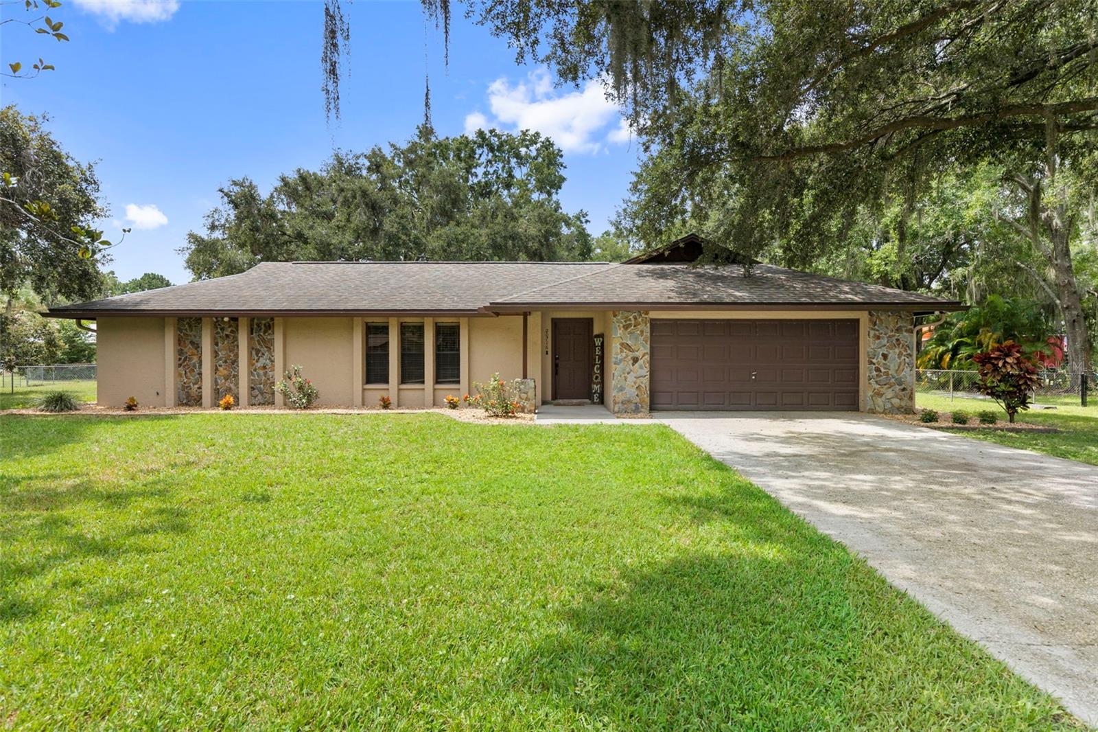 This charming 3-bedroom, 2-bathroom home offers the ideal mix of comfort, versatility and outdoor living. Situated on a spacious 1-acre lot just minutes from shopping and dining, it’s the perfect blend of privacy and convenience.
Step outside to your own backyard oasis featuring a private pool and screened back porch, perfect for quiet evenings, entertaining or watching sunsets. The fully fenced yard provides plenty of space to roam, and the 30x30 metal shop plus detached storage barn offer endless possibilities for hobbies, tools or toys.
Inside, the wood-burning fireplace adds warmth and charm, and thoughtful updates include: luxury vinyl plank flooring and baseboards (2019), kitchen cabinets (2019), guest bath tub replacement (2019), MyQ Garage Opener (2025), new porch screen & wood (2025) and updated landscaping (2025).
Additional features include gutters, a water softener, and the reliability of a private well and septic system, with the well pump replaced in 2023.
With no HOA and plenty of room to spread out, this home offers the freedom and flexibility to truly make it your own. Don’t miss this unique opportunity to enjoy peaceful Florida living with all the right extras!