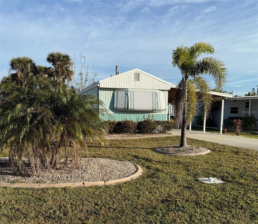 Wonderful location within the Pine Lake neighborhood for this mobile home with great curb appeal. Home damaged in Hurrican Milton and being sold "As-Is". Metal Roof. Newer Carport. No HOA or Deed Restrictions to hold you back. Love Salt Life?? This home is steps away from the canal where boat slips are often available to rent or purchase providing quick access to the intercoastal and Gulf with NO bridges! Beautiful flats nearby to explore with kayaks. This is a terrific opportunity to own an affordable piece of Florida a short distance from the picturesque beaches of both Manasota Key and Boca Grande. Golf Courses, Restaurants, Farmers Markets and shopping nearby to enjoy. Bring all your toys, the possibilities to use them are endless!