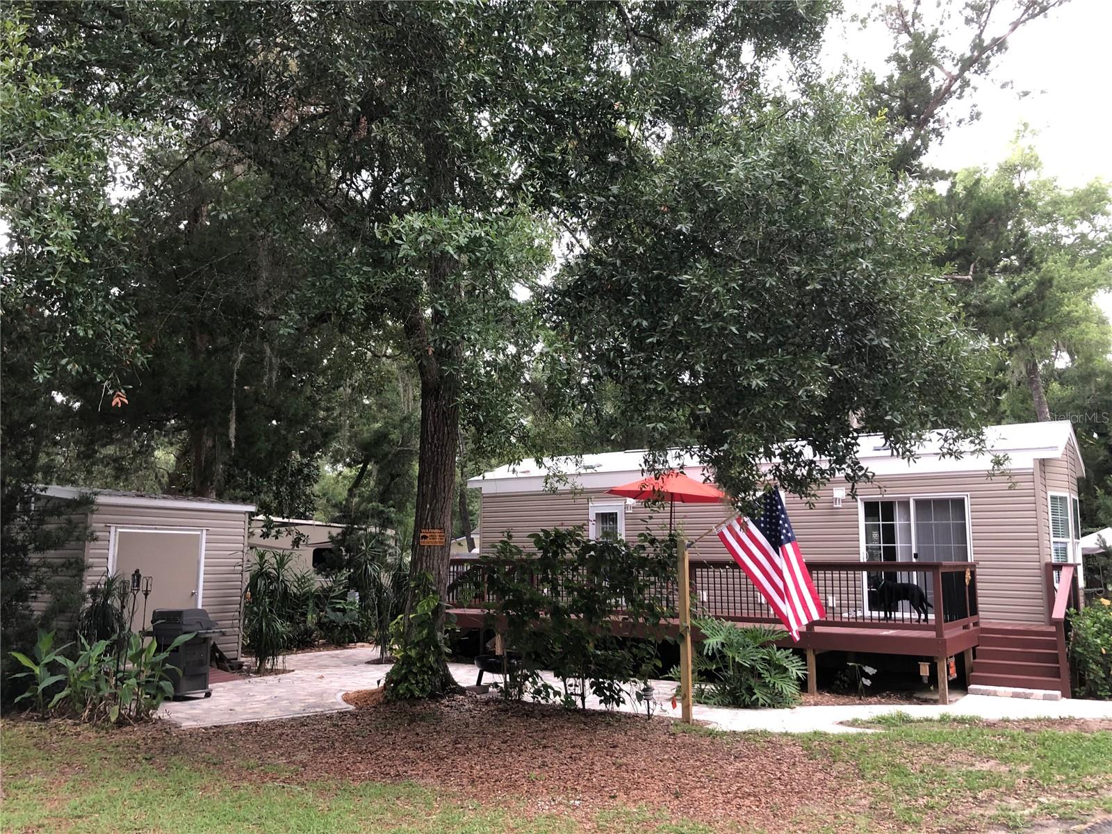 Welcome to your peaceful getaway in the sought-after Salt Springs Resort community! This charming 1-bedroom, 1-bath 2019 HUD park model RV sits on a deeded lot in Phase III of the resort and offers the perfect combination of comfort and convenience. Featuring a spacious 518 sq ft interior, this home includes vinyl plank flooring, a built-in kitchen, updated finishes, and central A/C for year-round comfort.
Enjoy the outdoors on two large decks totaling over 370 sq ft, ideal for entertaining or relaxing in the tranquil natural surroundings. Additional features include concrete pad, utility shed, and access to resort amenities like pool, boat ramp, clubhouse, and gated security.
Located just steps from Lake Kerr and the Ocala National Forest, this is the perfect low-maintenance home, vacation retreat, or income-producing rental. Short-term rentals are allowed! Don’t miss this opportunity to own your piece of paradise in Salt Springs!