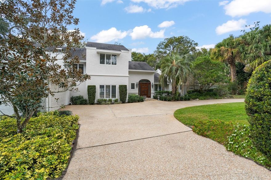 Presenting a magnificent lakefront retreat boasting timeless elegance, captivating sunset views, and glorious water vistas, perched along the pristine shores of Lake Minnehaha and the Winter Park Chain of Lakes. This classic home is a showplace of lakefront living with open water views from almost every room. Tucked within The Oaks section of Dommerich Estates, where peaceful mornings and tranquil nights offer a haven from the hustle and bustle, this grand home exudes style and class. Enter through a rich mahogany door to a foyer with beautiful rich wood flooring. The eye is instantly drawn to the picturesque windows lining the Great Room-style Living Room with cathedral ceilings and an expansive Florida room beyond, bathed in sunshine and showcasing sweeping lake views. A sparkling lap pool is perfectly suited to provide a refreshing break. The chef’s kitchen with center island cooktop, breakfast nook, custom cabinetry, beverage cooler, and stainless appliances is generous in size and serves as a gathering place for all. A wood-paneled Family Room is easily accessible and offers a cozy escape. On the opposite side of the house on the first floor sits the primary bedroom and den lined with bookshelves. The master suite features sliding glass doors, a large walk-in closet, double vanities, garden tub, and separate shower. Upstairs are three additional bedrooms including one ensuite and two bedrooms with lakefront balconies. A boathouse with pier stands ready to host watersport toys of all kinds. The cleared lakefront provides direct sandy beach access to the lake. Neighborhood features boardwalk access to Maitland Community Park with a playground and tennis courts. Zoned for highly sought-after Dommerich Elementary, Maitland Middle, and Winter Park High. Come experience living on the Winter Park Chain of Lakes from one of the most desirable locations in Central Florida.