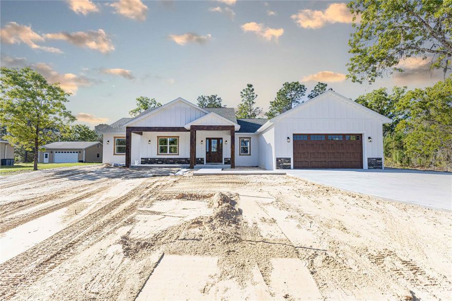 Welcome home, to your Luxury Custom Home on 1 Acre
This exceptional residence nestled in the sought-after Oak Hill subdivision of Wildwood, Florida, where timeless craftsmanship meets modern sophistication. Set on a spacious 1-acre lot, this stunning 3-bedroom, 2.5-bathroom block and stucco home has been meticulously designed to combine elegance, functionality, and durability—perfectly suited for the Florida lifestyle.
Elegant Design & Finishes. From the moment you step inside, you’ll be greeted by soaring ceilings, abundant natural light, and a thoughtfully designed open floor plan that seamlessly connects the living, dining, and kitchen areas. Every detail has been elevated with a custom trim and molding package, showcasing true craftsmanship and adding an upscale touch throughout.
The gourmet kitchen is a chef’s dream—boasting upgraded cabinetry, premium countertops, and stainless steel appliances—ideal for both intimate family gatherings and entertaining on a grand scale.
Luxurious Living Spaces. Each of the three bedrooms is generously sized, with the owner’s suite offering a tranquil retreat featuring a spa-inspired bath with dual vanities, a walk-in shower, and designer finishes. With two full bathrooms; and one half bath, convenience and comfort are ensured for family and guests alike.
Built to Last. Constructed with block and stucco, this home is engineered to withstand Florida’s unique climate, providing peace of mind for years to come. Energy-efficient design elements and upgraded finishes enhance both performance and beauty.
Building elements include, Masonry structure (not wood frame), 5/8 plywood roof decking (not pressed OSB), 5/8" ceiling drywall, R-30 Batt insulation with blow in, Walls between bedrooms and common areas are soundproofed, Low E insulated windows, Fiberglass composite exterior doors, Upgraded trim package to include custom doors and molding, Custom solid wood cabinets with stone countertops. 
Outdoor & Lifestyle. The expansive 1-acre lot offers endless possibilities—whether you envision a pool, outdoor kitchen, or serene garden space, this property provides the perfect canvas. The Oak Hill subdivision is known for its prestige, privacy, and prime location, just minutes from The Villages, world-class shopping, dining, and healthcare.
This is more than a home—it’s a statement of refined living in one of Wildwood’s most prestigious communities. Schedule your showing today, this home won’t last long!