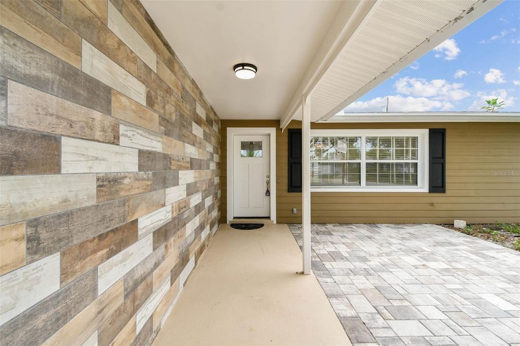 Photo of 10931 Hammock Drive, Largo, FL 33774 (MLS # TB8501365)