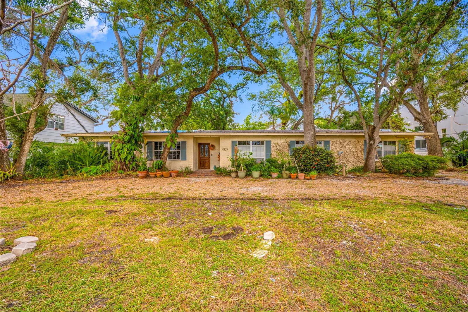 Come see this oversized 117x100 lot located in the heart of Sunset Park, one of South Tampa's most desirable neighborhoods. This lot offers a blank canvas to build a luxury residence with ample space for a pool, outdoor living space, circular driveway, & more! This property features numerous mature trees, which add to its character & aesthetic appeal. Situated in the sought after school district of Dale Mabry Elementary, Coleman Middle, & Plant High. Convenient location just minutes from the Westshore Business District, Downtown Tampa, Channelside, Midtown Tampa, Hyde Park Village, International Plaza, & Tampa International Airport. The existing home was flooded during Hurricane Helene and is being sold "As-Is". Property is selling for land value only. Don't miss this opportunity to build your dream home on this gorgeous lot!