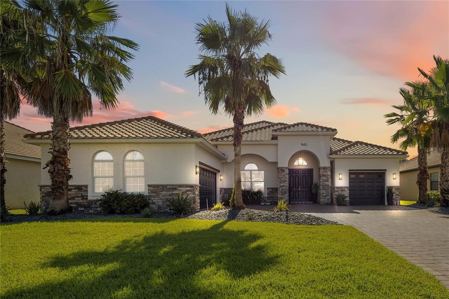 Welcome to 945 145th St Cir NE, Bradenton, FL – a meticulously upgraded 3 bedroom + large Bonus Room, 3 bath 2787 sq. ft. pool residence, designed for both everyday comfort and elegant entertaining.  An expansive private rear yard too! From the moment you arrive, the home makes an impression with its real stone columns, fresh exterior paint, upgraded landscaping with custom lighting, and paver driveway and walkway. Step inside to find rectified Italian porcelain flooring flowing through the main living areas, complemented by engineered hardwood in the bedrooms. Arched entries, rounded corners, vaulted tray ceilings, and crown molding enhance the open layout, while collapsing pocket sliding glass doors seamlessly connect the Great Room to the outdoor living space. Throughout the home, 5 ¼” baseboards and 8-foot doors add a refined, custom finish.  The heart of the home is the upgraded kitchen, featuring dovetail soft-close cabinetry with crown molding, granite countertops, a counter-height peninsula, under-cabinet lighting, and a vented glass/stainless-steel hood. A custom walk-in pantry, bar nook with quartz countertop and wine fridge, and upgraded fixtures complete the space. The laundry room is equally well-appointed with cabinetry, sink, washer/dryer, and an additional storage closet.  The oversized media room, spanning over 400 sq. ft., offers flexibility to serve as a second master suite or entertainment space. The primary suite itself is a retreat, featuring custom dual walk-in closets with built-ins, blackout curtains, and a luxurious bath with a soaking tub beneath a chandelier.  Outdoor living is truly exceptional. A screened, extended lanai of over 1,000 sq. ft. showcases upgraded pavers, ceiling fan, and it’s already plumbed for an outdoor kitchen and TV wiring. The heated saltwater pool with brick coping is paired with a lighted spa cascading into the pool. For peace of mind, the lanai is protected by UV-rated hurricane screens, with storm shutters for windows and doors. The lushly landscaped yard includes four mature coconut palms and over 50 magnolia trees, all maintained by an automatic sprinkler system.  Additional highlights include epoxy-coated garage floors with “Florida basement” for raised shelf storage, monitored outdoor cameras and motion lighting for extra security, tinted double-pane windows, and upgraded chandeliers and fixtures throughout.  This home combines high-end finishes, practical upgrades, and extensive indoor-outdoor living – a rare opportunity in the gated community of Enclave at Country Oaks in Bradenton.  View property website at: https://tours.snaphouss.com/945145thstreetcirclenortheastbradentonfl34212?b=0