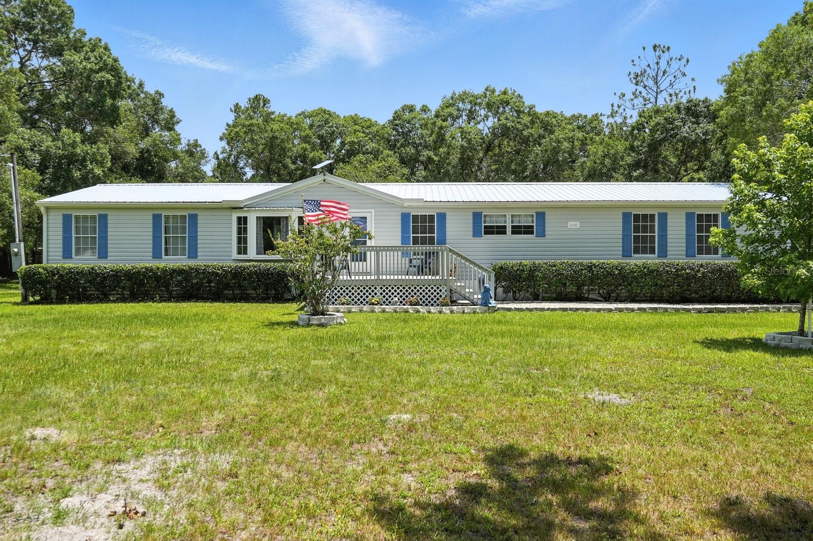 Must See to Appreciate all this property offers! Unique Private Retreat on 2.07 Acres in Flagler Estates, Hastings, FL
Welcome to your dream home, nestled on a sprawling 2.07-acre estate in the serene setting of Flagler Estates, Hastings, FL. This rare opportunity combines privacy, luxury, and functionality, perfect for those seeking a home that has it all!
Benefit from being in a neighborhood known for its excellent schools and family-friendly environment. Enjoy peace and security with a fully fenced with Driveway LED Lighting, meticulously manicured landscape, ideal for pets and children. Ranch Style Home: Experience the charm of ranch-style living with a fully updated interior that marries modern amenities with cozy comfort. The whole home has been freshly painted, making this turn key and move in ready!
The Wood burning Fireplace is the focal point of the formal living room and has been refaced for an updated aesthetic: Keep warm and cozy during cooler evenings with a charming fireplace - Gourmet Kitchen: Cook like a chef in an expansive kitchen featuring granite countertops, reverse osmosis for drinking and cooking water, a massive island, and ample storage.- Spacious Interiors: Delight in generously sized walk-in closets, providing ample storage space throughout the home.
-Convenient Amenities: Enjoy the convenience of an in-house laundry room and a new heated and cooled Florida room addition for year-round relaxation added 144’ sq. ft. of heated and cooled living space with electric, windows and new interlocking vinyl plank flooring..
-Outdoor Features: Explore recreational trails, a pole barn with RV hookup, and a generously sized driveway expanded rolled rock driveway to accommodate multiple vehicles; motor cars, boats, RV, chickens, 1 horse per acre; ideal for farmette.
-Versatile Pole Barn: Utilize the pole barn for garage space, storage with shelving and electrical receptacles. Has its own electrical panel with room for expansion, or can be utilized as a workshop, perfect for hobbyists or additional living space.
- Garden Heaven: Green thumbs will appreciate the included greenhouse with full electric, thermostat, exhaust fans, lights and GFCI Outlet. The property boasts beautiful garden areas, perfect for cultivating plants and flowers.
- Additional Living Quarters: The in-law suite or one-bedroom apartment, attached to the pole barn, includes a kitchenette, full bath beautifully tiled, and bedroom with heating and cooling, tankless hot water, and additional 262’ sq. ft. of living space. Guest retreat or potential income.
This estate offers the best of both worlds – a private, tranquil environment with all the conveniences and luxuries today's homeowners’ desire. Don’t miss this rare opportunity to own such a distinctive home in the heart of Flagler Estates. Schedule your private showing today!