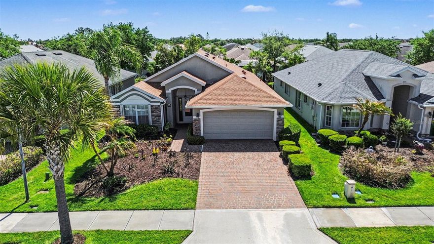 Priced to sell! Beautiful 3 bed, 2 bath pool home in spectacular Heritage Isle gated 55+ community. Tree lined streets, walking paths, ponds, & paver driveway to move-in ready manor home. Open floor plan & vaulted ceilings in light & bright setting. Large primary bedroom, double sinks, roll in shower, custom closet. Split plan, 2 spare bedrooms, tub/shower combo in guest bath. Eat-in kitchen, breakfast bar, ample cabinets, large pantry. Living, dining & family rooms all flow to screen enclosed private pool & spa. Freshly painted interior. Roof 2022. AC 2018. Accordion Hurricane Shutters! Incredible community amenities. Resort style Pool, Tennis, Pickleball, Bocce, Shuffleboard, Horseshoe, and Outdoor Lakefront Pavilion. Private restaurant, Isle Bar & Grill. Work out in the gym, play cards, games, billiards, or join a club! Activities galore! Bike to Viera Wetlands for bird watching. Short drive to Duran Golf Club. Endless shops & restaurants around The Avenues.