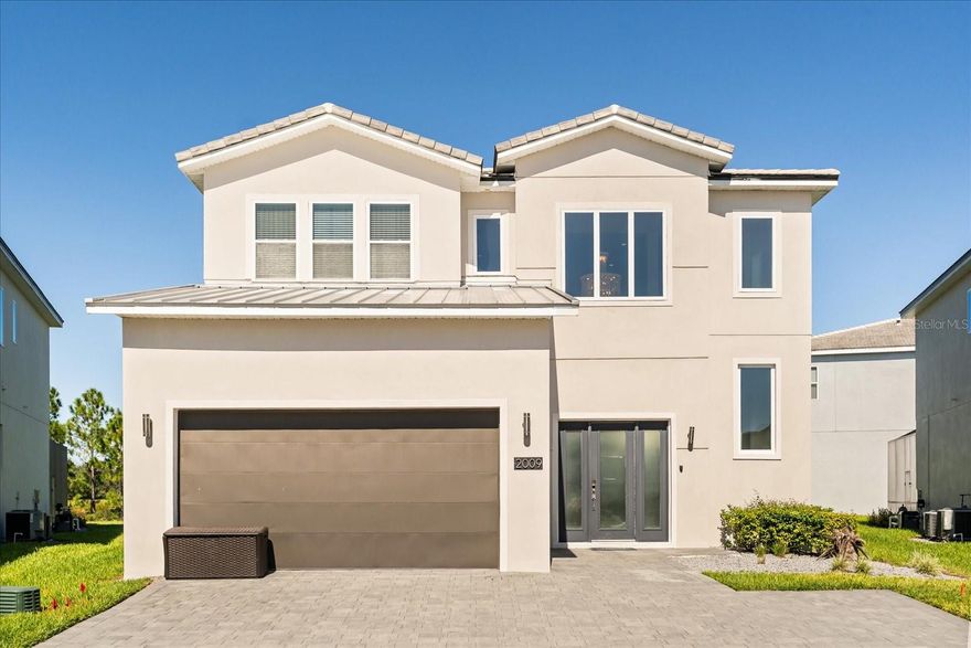Discover Celestial Castle, a stunning 6-bedroom, 4-bath pool home in the 24-hour guard-gated Solterra Resort. Perfect for investors or personal use, this fully furnished, turn-key property is currently used as a VRBO rental and offers strong income potential. You or guest will enjoy a luxurious chef-style kitchen with built-in oven, microwave, and natural gas range. The open concept living and dining space is ideal for large gatherings! Spacious ensuite bedrooms, two on the first floor and the primary plus four upstairs, plus an upstairs loft for extra living space. The garage has been converted to a game room, easily restored if desired. Florida living at its finest with al fresco dining on your covered lanai and summer kitchen with hooded vent and grill. Relax poolside in your private pool with spa and take in serene wooded and pond views. World-class resort amenities include a resort pool, lazy river, luxury clubhouse, tennis and pickleball courts, and fitness center. Just minutes from Disney, Universal, downtown Orlando, and the beaches, this home delivers the perfect blend of lifestyle and income potential.
