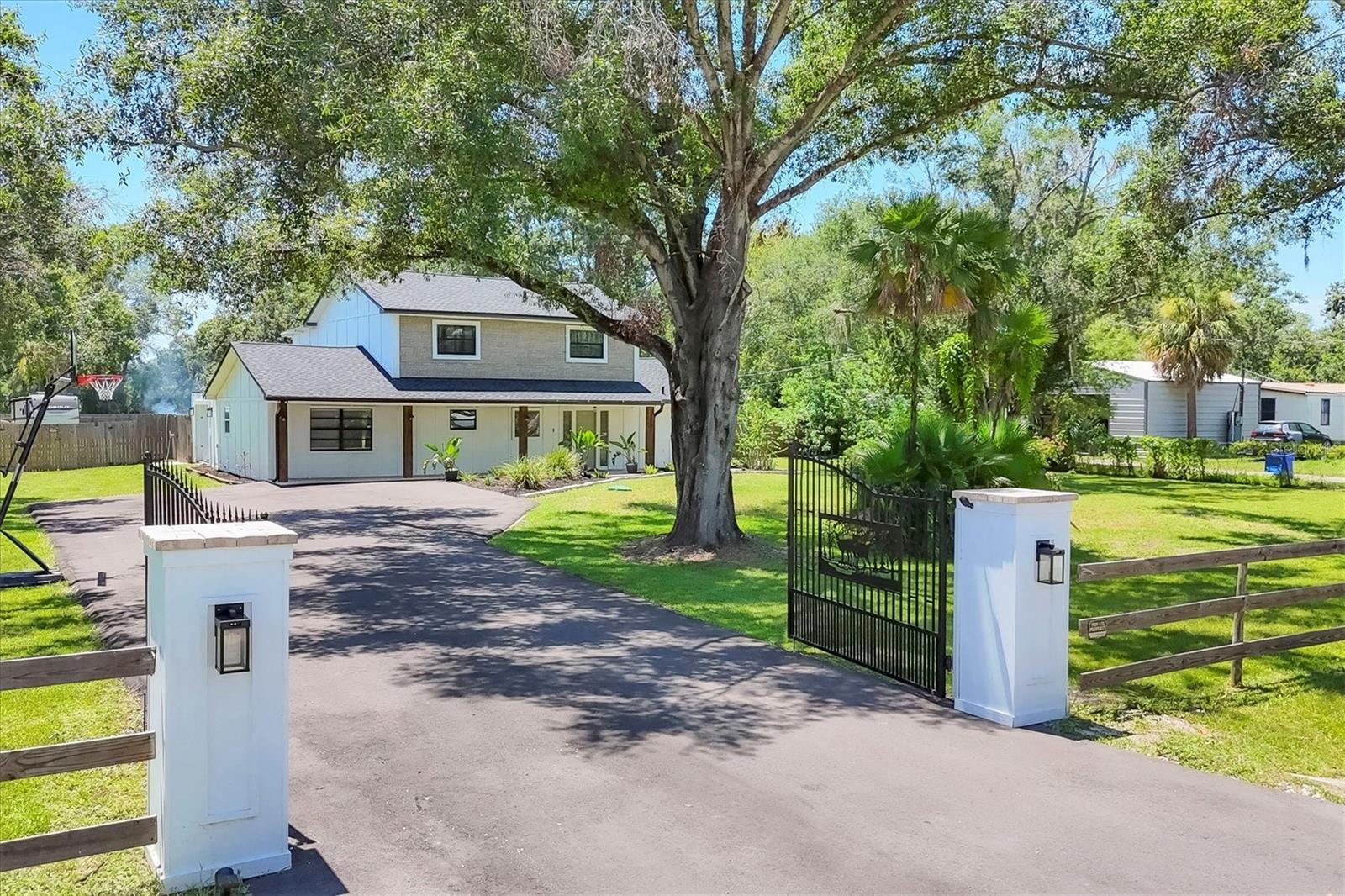 Tired of living in tight spaces in developments? Break free! This large 4 bedroom 3 1/2 bath home sits on a beautiful, quiet and private 1 acre fenced lot plus security gate. Feel like you're off-grid with a newer well and septic (no water/sewer utility bill)! Bring your toys, animals, hobbies and live your life close to shopping and dining, but away from the hectic city life! Relax in the heated, in-ground pool with cabana; Work from home with two - 1st floor private offices; bring a guest to live in the upstairs 2nd master suite that enjoys a balcony overlooking the private, green-grass backyard! This home has been remodeled with a new roof, new flooring, new pool pump, new skimmer, newer kitchen, refinished pool & AC (2022). Check out the photos of the beautiful master bath - like out of a showroom! Too many upgrades to mention here. OH! Did I forget to mention - a newer water softener and whole house SMART HOME SYSTEM! If you are looking for extra elbow room on a quiet, private 1-acre lot that feels like a new home - make an appointment to see THIS HOME!