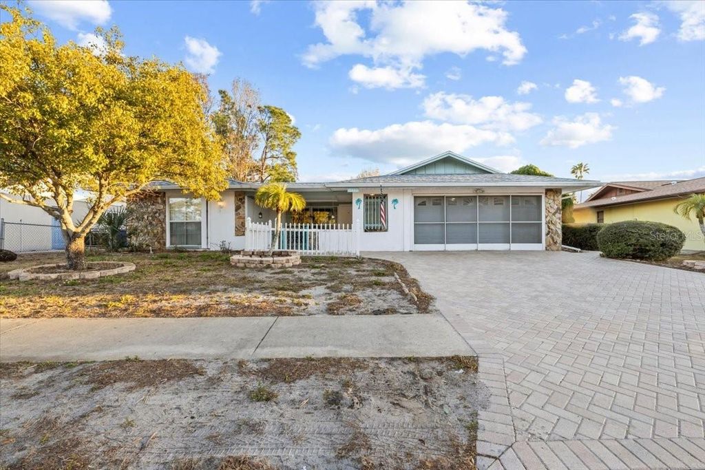 Photo of 7132 Bramblewood Drive, Port Richey, FL 34668 (MLS # TB8473719)