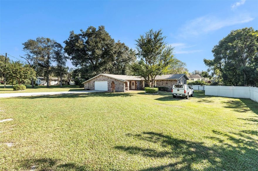 One or more photo(s) has been virtually staged. 3% Assumable VA Rate! Welcome to this spacious 4-bedroom, 3-bathroom home with a 2-car garage, offering 2,304 sq ft of living space on nearly half an acre (0.44 acres)! Enjoy peace of mind with a newer roof, A/C, and water heater—all updated in 2020. This property is not in a flood zone and comes with no HOA or CDD fees, giving you more freedom and fewer expenses. The oversized lot provides plenty of space to park multiple vehicles, an RV, boat, or whatever suits your lifestyle. A great opportunity for those seeking space, flexibility, and value! Schedule your showing today! You won't be disappointed! ONE OR MORE PHOTOS HAVE BEEN VIRTUALLY STAGED.