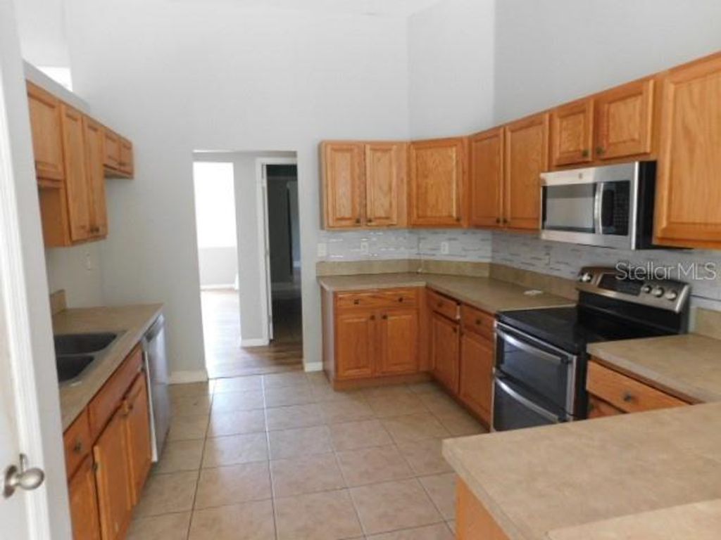 Photo of 10512 Van Wyck Terrace, Port Charlotte, FL 33981 (MLS # K4903490)
