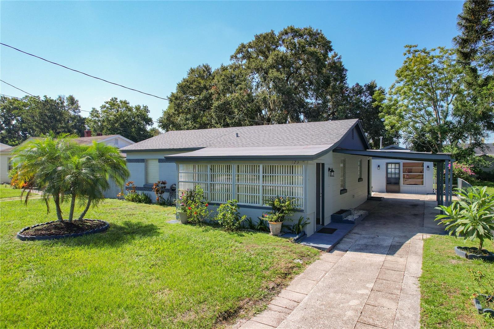 Charming Remodeled Home with Income Potential in Lakeland!
Discover your dream home at 123 Tarawa St, Lakeland—a beautifully remodeled 3-bedroom, 1-bathroom single-family residence offering 948 square feet of contemporary comfort on a spacious 0.18-acre lot in the sought-after Lakeview Village subdivision. Step inside to an inviting open layout featuring durable and stylish vinyl plank flooring throughout, complemented by efficient central air conditioning and heating for year-round comfort. The well-equipped kitchen includes essential appliances such as a cooktop, refrigerator, while the laundry area comes complete with a washer and dryer. What truly sets this home apart is the versatile detached Accessory Dwelling Unit (ADU) in the backyard—a fully self-contained 1-bedroom, 1-bathroom guest suite with its own kitchen and 320 square feet of living space. Ideal for multigenerational living, visiting guests, or generating rental income, this bonus feature unlocks excellent passive income opportunities without compromising your privacy. Outside, the stucco exterior and shingle roof provide low-maintenance durability, while the fully fenced yard offers a secure space for pets, play, or gardening. Enjoy the lush garden area, convenient storage shed, and a covered carport accommodating up to 4 vehicles. WITH NO HOA FEES to worry about. Perfectly positioned near US-98 and I-4, this home ensures effortless commuting and easy access to Lakeland's shopping, dining, and entertainment options. This vacant property is offered as-is and ready for immediate occupancy—don't miss this gem! Schedule your showing today and envision the possibilities.
