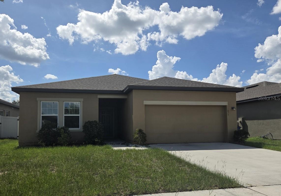 4/2/2 in Orchid Grove, this home offers a split bedroom plan with large open living space. Beautiful kitchen with stainless steel appliances and granite counter tops! Orchid Grove has a community pool and park. With easy access to US-27 and I-4. NOT A SHORT SALE, can close quickly!