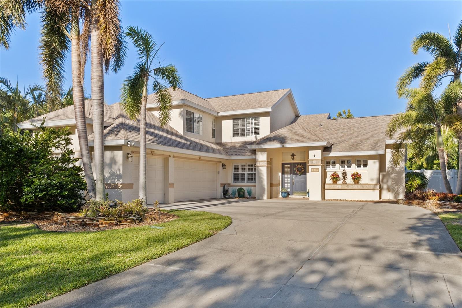 Impeccably maintained pool home with premium upgrades throughout! From the moment you arrive, you'll notice the exceptional care and attention to detail that sets this home apart. The beautifully landscaped front yard is designed for low maintenance, offering a clean, welcoming look year-round. Step into your own private oasis in the fenced backyard, featuring a resurfaced (2024) inground pool with a premium Pebble Tech finish—backed by a lifetime warranty. The pool is also heated by an electric heat pump, ensuring year-round enjoyment. Other key structural upgrades include: new asphalt roof (2020), York 3.5-ton AC system installed in 2021 (with parts and labor warranty through 2031), additional upstairs AC installed in 2024, commercial grade water heater (2021), and extra R22 insulation added over existing R30 for enhanced energy efficiency. The storm-resistant, glass/screen-enclosed lanai (added in 2015) provides extra living space—perfect for all seasons, rain or shine. The kitchen is a chef's dream with all-wood custom cabinetry, granite countertops, tile backsplash and new Bosch appliances (2024). The recently remodeled primary bathroom features a luxurious Roman walk-in shower, double vanities with quartz countertops and Toto bidet/toilet for added comfort and elegance. Beautiful hardwood floors in the family room, formal living, and main-level primary bedroom and luxury vinyl plank flooring upstairs, (where you'll also enjoy crown molding and a fully updated bath). Plantation shutters adorn most windows. The oversized, side-entry 3-car garage includes built-in cabinets, a workbench, and 150 sq. ft. of overhead storage—ideal for hobbyists or extra organization. This home truly has it all and is move-in ready for you and your family!