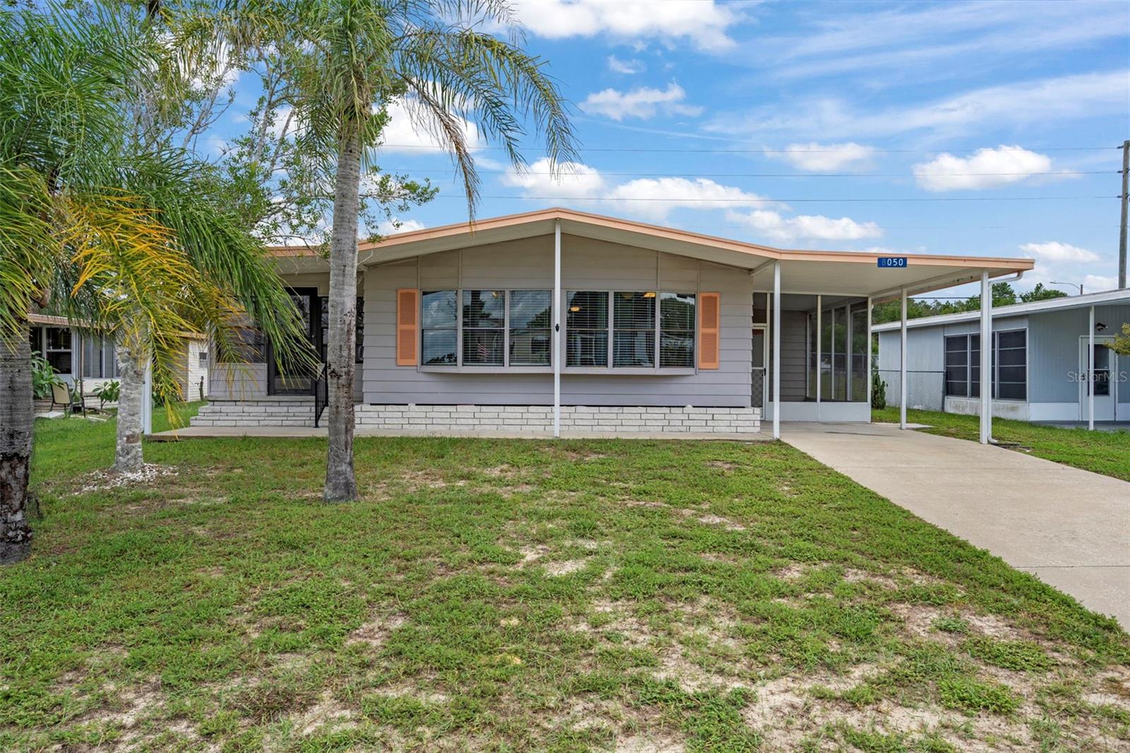 Freshly painted 2 bedroom, 2 bath home with new flooring throughout. Updated kitchen and bathrooms. High ceilings add to the open feel. Large enclosed Florida room with AC plus a screened patio for outdoor enjoyment. HVAC replaced in 2022 and roof replaced in 2017. Located in the vibrant and active 55+ High Point Golf Community, offering tons of amenities such as Golf, tennis, pickleball, heated pool, social events and so much more. High Point is located close to shopping, restaurants, entertainment, and medical facilities. Low HOA fees and you OWN YOUR OWN LAND.