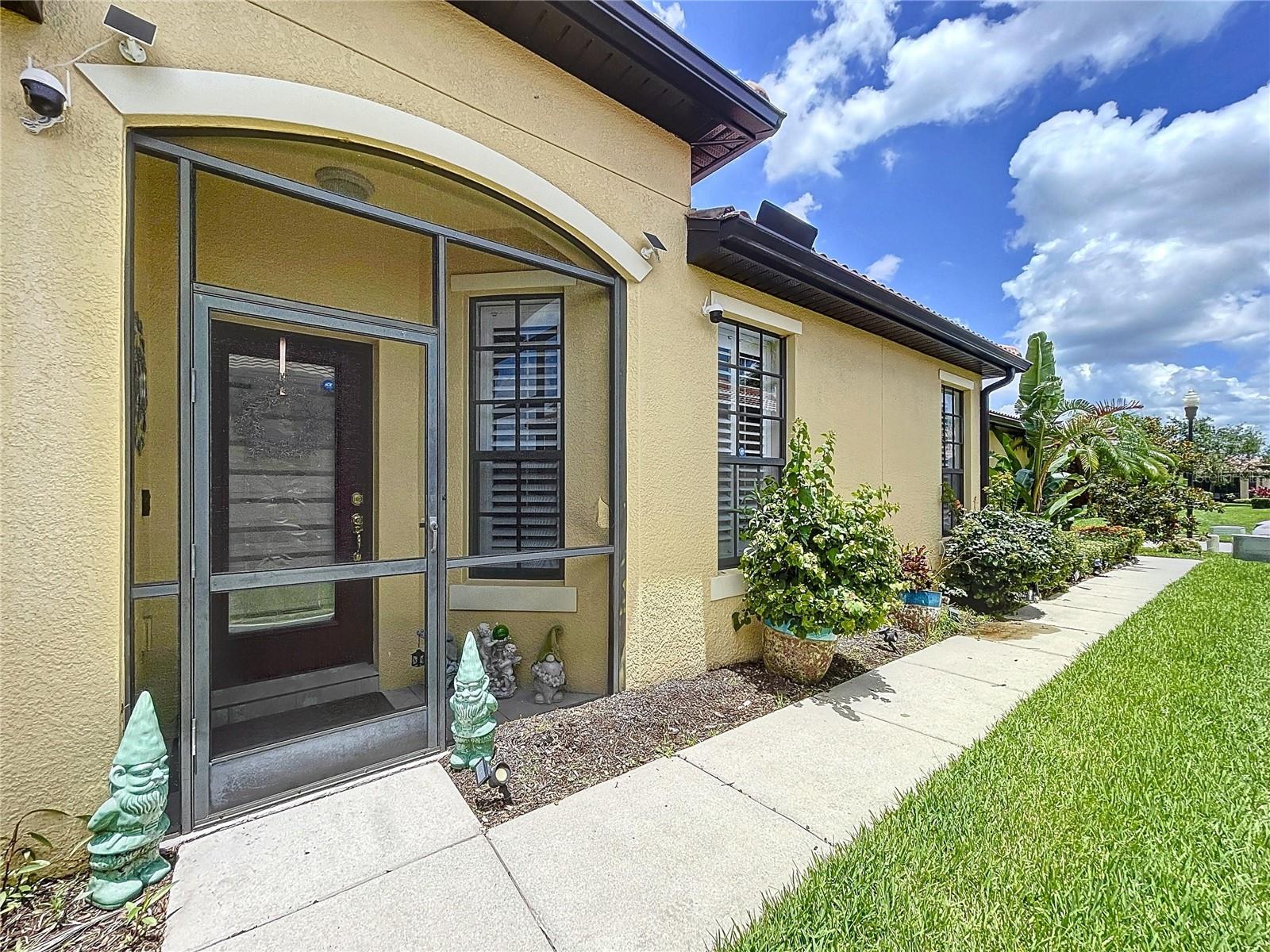 Welcome to Paradise! Retire in style! This Southshore Falls VILLA has been meticulously maintained! 2 bed 2 bath home featuring a gourmet kitchen with 42' cabinet and gorgeous solid surface counters. Ceiling fans in every room, a split bedroom floor plan making it perfect for entertaining guests, also an oversized barn style rolling door offering even more privacy! ENJOY THE FLORIDA LIFESTYLE on the screened and tiled EXTENDED LANAI! Lots of storage space with additional overhead storage in the garage! This community boasts fun and friendly neighbors - the pristine entry & waterfall makes for a grand entrance - so many activities to choose from with the 14,000 sq ft clubhouse which is the heart of the community! It offers a tropical lagoon pool, resistance pool, hot tub, putting green, bocce ball, shuffleboard courts fitness center, hobby and craft room, library room, coffee cafe, billiards, card room and many clubs like Biking and Kayaking! Perfect location, close to beaches and theme parks, close to Tampa, Bradenton, Sarasota and St Petersburg to enjoy the Arts and Culture!