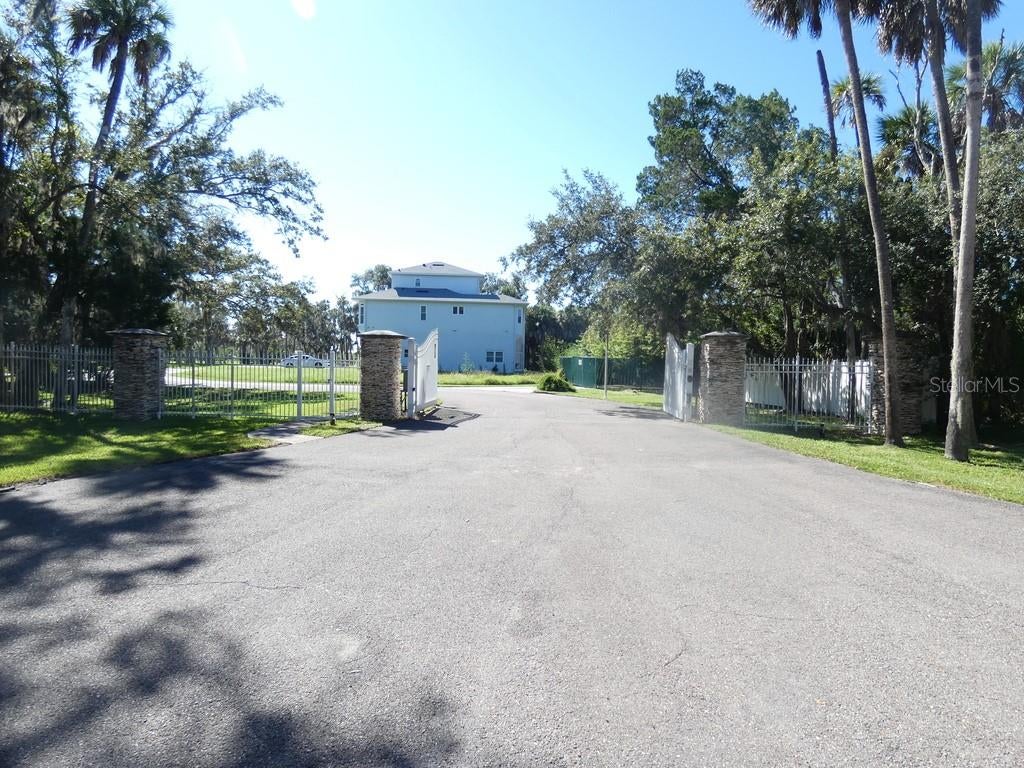 5405 TROPICAL WOODS COURT