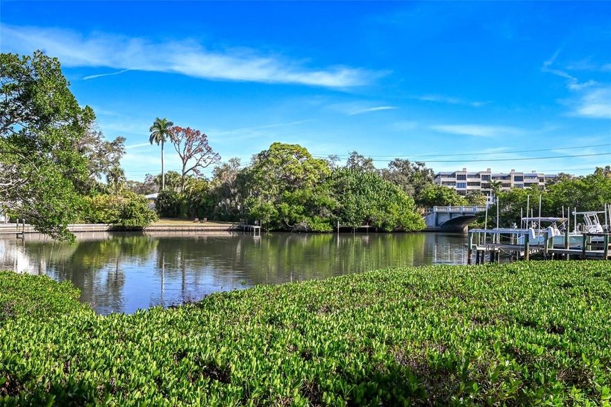 Seeking instant gratification? Welcome to one of downtown Sarasota’s most hidden gems. Located in Lincoln Park on Hudson Bayou, this intimate enclave of just eight residences offers a rare blend of privacy, charm, and immediate access to the very best of Sarasota’s cultural and waterfront lifestyle. Tucked along the tranquil waters of Hudson Bayou, the setting is serene yet remarkably close to downtown’s celebrated restaurants, theaters, art venues, and the iconic Marie Selby Botanical Gardens. As you arrive along the tree-lined street, the home’s Craftsman-style architecture immediately captures attention. A freshly painted exterior featuring HardieBoard siding and accents delivers timeless appeal with low maintenance living in mind. Inside, the residence strikes a perfect balance between comfort and modern sophistication. Every detail reflects the owner’s discerning eye for design. A charming brick-lined front porch leads to an inviting entry and a versatile sitting room—ideal as a home office, reading nook, or a sunlit spot to enjoy morning coffee. The curated eat-in kitchen is the centerpiece of the home, appointed with upgraded Bosch appliances, a gas cooktop, and thoughtful finishes that elevate both form and function. Adjacent, the spacious living room features a custom built-in entertainment center and offers the perfect setting for relaxed evenings, family gatherings, or conversation with friends. French doors open to a true waterfront sanctuary—an outdoor retreat complete with Brazilian Ipe decking, a heated pool and spa, and peaceful bayou views. The primary suite is conveniently located on the main level, offering a luxurious, spa-inspired bathroom with custom tile work. Upstairs, three generously sized guest bedrooms provide ample space and flexibility. One functions beautifully as a second primary suite, featuring a stunning custom bath that rivals the main suite. A fourth bedroom is currently configured as a den with an armoire and custom built-in cabinetry. Adding to the home’s rare appeal is a deeded boat slip with a 10,000-pound lift directly on Hudson Bayou, offering immediate access to Sarasota Bay and beyond. Perfectly positioned between downtown Sarasota and Southside Village, this exceptional residence places dining, shopping, recreation, and culture just moments away. It would be remiss not to mention your choice of award-winning beaches a few minutes' drive away. Private showings available by appointment.