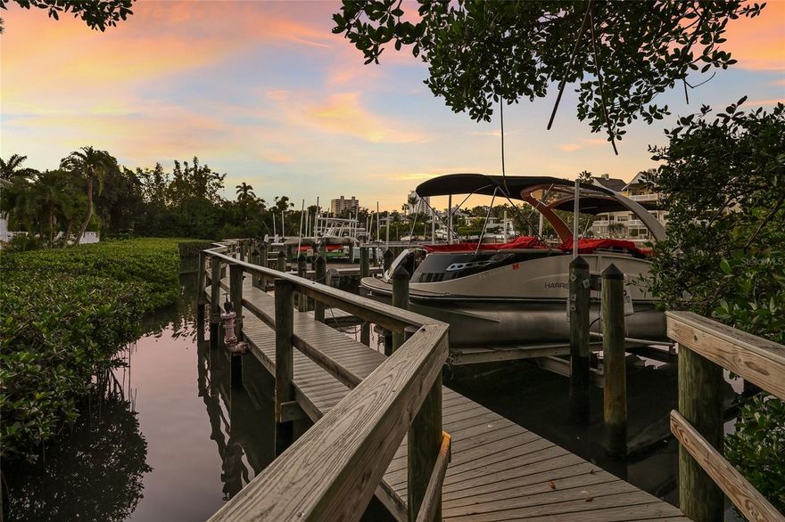 Downtown Waterfront with a straight route to Sarasota Bay and the Gulf of Mexico! Making this home a rare find is the deeded slip, 10,000-pound lift, space for a 30-foot boat, and a meticulously maintained dock by the HOA.    
Located in the mature-tree lined and cool shaded setting of Lincoln Park on Hudson Bayou, this intimate enclave of just eight residences is serene yet perfectly positioned between downtown Sarasota and Southside Village, placing Morton’s, Veronica’s, Marie Selby, Farmers Market, theatre, dining, shopping, recreation, all within minutes by foot.  
As you arrive at the park-like setting, the home's Craftsman-style architecture immediately captures attention. A freshly painted exterior featuring HardieBoard siding and accents delivers timeless appeal with low maintenance living in mind. Inside, the residence strikes a perfect balance between comfort and modern sophistication. Every detail reflects the owner's discerning eye for design. A charming brick-lined front porch leads to an inviting entry and a versatile sitting room ideal as a home office, reading nook, or a sunlit spot to enjoy morning coffee. The curated eat-in kitchen is the centerpiece of the home, appointed with upgraded Bosch appliances, a gas cooktop, and thoughtful finishes that elevate both form and function. Adjacent, the spacious living room features a custom built-in entertainment center and offers the perfect setting for relaxed evenings, family gatherings, or conversation with friends. French doors open to a true waterfront sanctuary-an outdoor retreat complete with Brazilian Ipe decking, a heated pool and spa, and peaceful bayou views. The primary suite is conveniently located on the main level, offering a luxurious, spa-inspired bathroom with custom tile work. Upstairs, three generously sized guest bedrooms provide ample space and flexibility. One functions beautifully as a second primary suite, featuring a stunning custom bath that rivals the main suite. A fourth bedroom is currently configured as a den with an armoire and custom cabinetry. It would be remiss not to mention your choice of award-winning beaches a few minutes' drive away. Private showings available by appointment.
