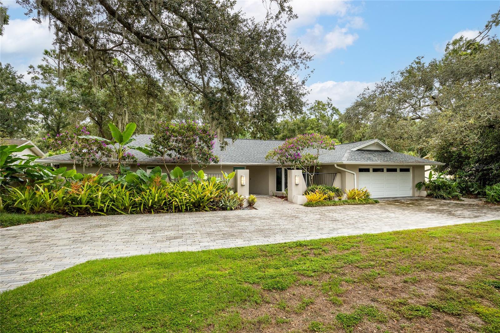 Tucked away on peaceful Hudson Lane, this Carrollwood residence isn’t just a house, it’s a story. Over the years, the owners of 4308 Hudson Lane poured their hearts into creating a place full of memories. Every room, feature, and finish was chosen with purpose, blending craftsmanship with comfort so family and friends could come together and feel at home. Entering the foyer, you'll notice how the natural sunlight fills the home with a warm and inviting feel along with the glass bird cage that the owners had built out for their birds which can easily be converted into a wine cellar. A striking large built-in fish tank once filled with vibrant corals and marine life creating a living focal point designed to bring nature indoors. Off the foyer is a separate office space, perfect for anyone that works from home. The chef's kitchen is the heart of the home and is equipped with Thermador and Bosch appliances, granite countertops, two full size refrigerators and an under counter wine refrigerator. You'll find the expansive primary suite on the left side of the home with hardwood floors, a custom walk in closet, and fully remodeled primary bathroom (2024). Off the primary suite is a separate bedroom with a Murphy bed that would make the perfect space for nursery. There is a designated office with built in shelving, perfect for working from home, crafting, or homeschooling. On the other wing of the house are the 2 remaining bedrooms that share a beautifully tiled Jack-and-Jill bathroom. As you step outside the backyard oasis, you'll notice 15,000 gallon, 7ft deep saltwater pool and expansive travertine deck. The pool (resurfaced in 2019) comes with a waterfall, Polaris VRX IQ+ robotic pool cleaner, and custom pet diving pad. The outdoor covered lanai boasts 576 sqft and is loaded with a full outdoor kitchen (gas stove top, double oven, hood, microwave, dishwasher, built in AOG grill, wine fridge, refrigerator), misting cooling fans, heaters, speakers, motorized screens, Werever outdoor cabinets, Vetrazzo countertops, AZEK decking with built in bench. This outdoor area was made for entertainment YEAR ROUND! Relax and unwind on the separate AZEK deck overlooking Sweetwater Creek, where the owners have seen river otters come up for a visit! The landscaping outback is lush and features mango trees, lemon trees, and banana trees providing fresh fruit and privacy in this backyard oasis.
Other notable updates and features include: new roof (2023), main HVAC 2011, rear HVAC 2019, garage propane tankless water heater 2018, outdoor propane tankless water heater 2013, hurricane impact windows and doors, Kinetico water softener, R19 spray foam insulation in attic (2018), Gladiator Gearwall panels and shelving in garage, irrigation system, 5 hose reels with hoses, landscape lighting, 2 motorized attic lifts, whole home generator.
This home has been well loved and cared for by its owners but now, it's ready for its next chapter. Schedule your private showing today!