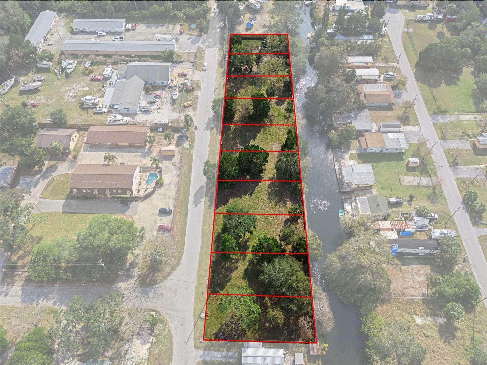 RARE DEVELOPMENT OPPORTUNITY - 10 BUILDABLE WATERFRONT LOTS: Exceptional opportunity to acquire 10 prime lots with direct Gulf access via canal and saltwater with seawall installed. FEATURING NATURAL FRESHWATER SPRING AND MANATEE VIEWING - truly unique waterfront setting! Direct boating route to Gulf of Mexico perfect for luxury custom homes, vacation rentals, or spec buildings. 9 lots zoned R4 residential + 1 lot zoned C2 offering rare mixed-use waterfront opportunity. SELLER PREFERS TO SELL AS COMPLETE BLOCK at $33K per lot ($330K total) - individual lots or smaller quantities available at higher per-lot pricing. Perfect for custom home builders, investors seeking multiple waterfront properties, developers planning waterfront communities, or individuals looking for a dream Gulf-access homesite with commercial potential and incredible natural amenities. Priced to sell quickly in Hudson's rapidly growing market!