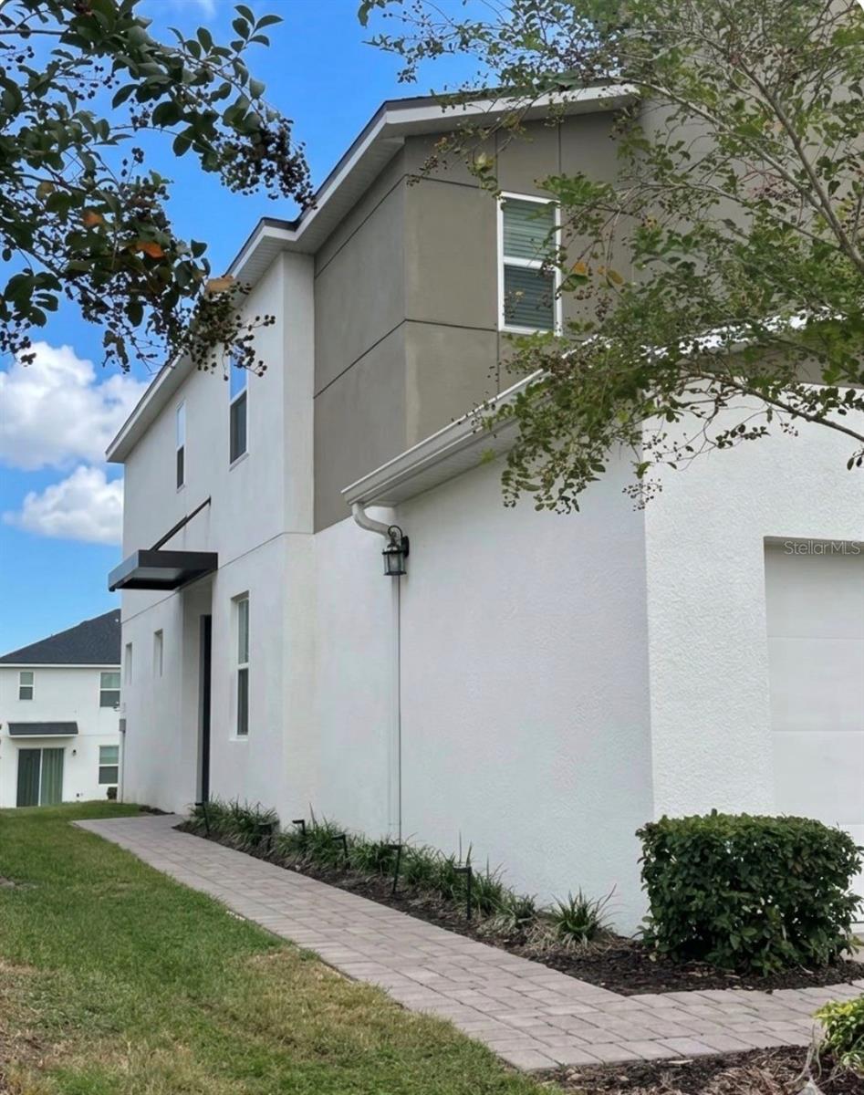 Photo of 1123 Boardwalk Place, Kissimmee, FL 34747 (MLS # O6448594)