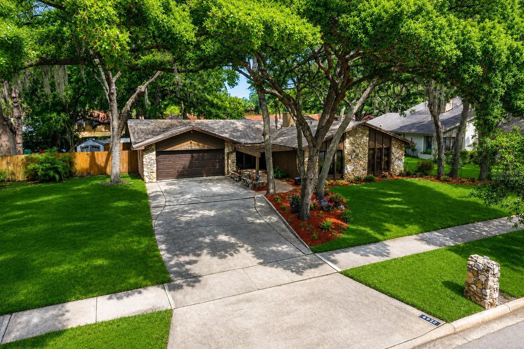 Photo of 4922 Briar Oaks Circle, Orlando, FL 32808 (MLS # O6414887)