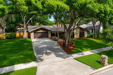 Photo of 4922 Briar Oaks Circle, Orlando, FL 32808 (MLS # O6414887)