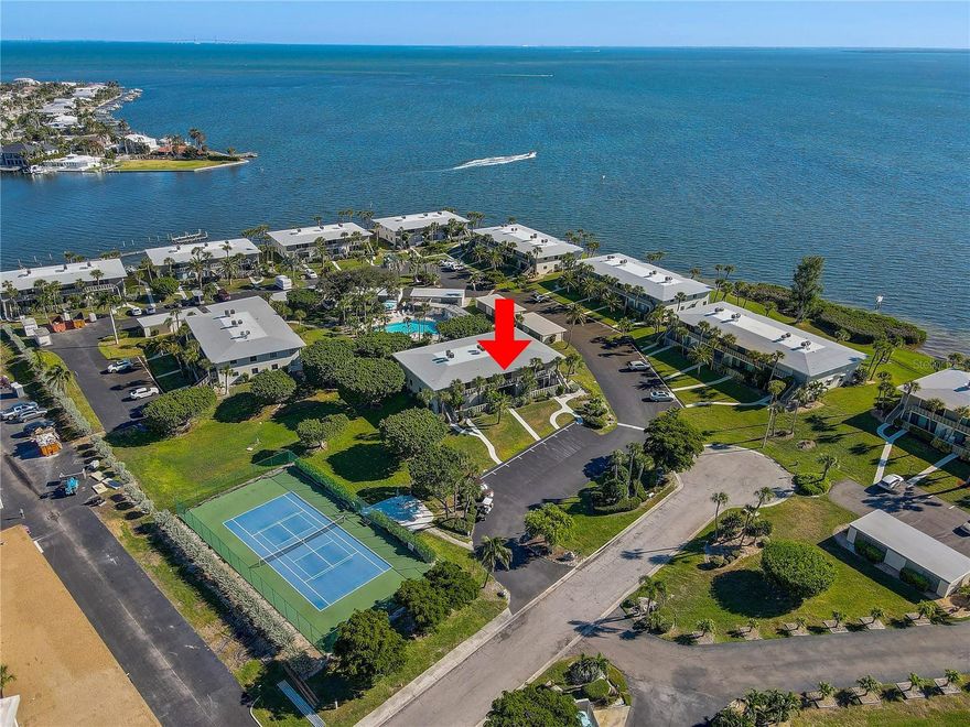 Condo on Anna Maria Island, FULLY FURNISHED 2 bed 2 bath, perfectly situated within 1 MILE OF THE BEACH. HIGH AND DRY! Enjoy the breezy GLASSED IN FLORIDA ROOM overlooking the pool or close the sliding glass windows to enjoy the view with air conditioning. Front entrance opens into the shady SCREENED-IN LANAI, LAUNDRY CLOSET is to the left with stackable WASHER/DRYER. Convenient STORAGE CLOSET/WORKSHOP to the right. Original parquet flooring in the foyer. Kitchen has a large pass through opening to the dinning room. Home provides a spacious dwelling area with living/dinning room combo. RECENT UPDATES: ROOF, HVAC, WATER HEATER, and CARPET. Remote controlled ELECTRONIC HURRICANE SHUTTERS for extra protection. Community includes a private BOAT RAMP, BOAT DOCK that doubles as a fishing pier, 2 HEATED POOLS, SPA, TENNIS COURTS, KAYAK/PADDLEBOARD STORAGE and open parking. MAINTENANCE FREE LIVING: CONDO FEE INCLUDES: cable tv, high-speed internet, water, sewer, trash, ground maintenance, exterior maintenance, master insurance, pool, spa and more. Just a 2-minute walk to the CENTRAL PARK which features a DOG PARK, PICKLEBALL COURTS, SKATE PARK, BASKET BALL, BALL PARK, PLAYGROUND and OUT DOOR FITNESS CENTER. Minutes away from sandy beaches and sunshine, the entire island is GOLF CART FRIENDLY, making it easy to explore. Enjoy a cozy atmosphere with local bike shop, restaurants, shopping options, and multiple access points to the beach.