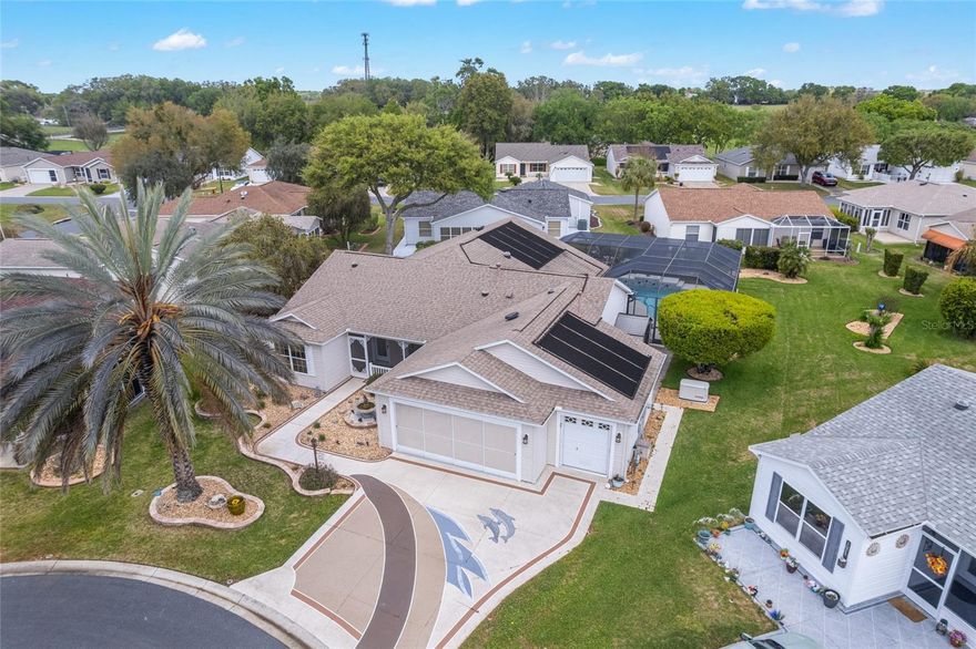 Your Own Florida Oasis!
Welcome to your private Florida retreat in the heart of The Villages! Tucked away on a quiet cul-de-sac, this beautifully maintained 3-bedroom, 2-bath Entertainer's dream home has both a living room and a family room as well as a versatile flex room offering the perfect blend of comfort, functionality, and resort-style living with a space for everyone!
Step inside to discover a spacious, thoughtfully designed open floorplan with a layout ideal for both everyday living and entertaining. The beautifully appointed kitchen with granite counters, stainless steel appliances and a double oven is central to the two living areas as well as the lanai. The flex room provides endless possibilities—perfect for a home office, hobby space, or additional guest area. The primary suite is separate from the two guest rooms, and the guest bedrooms are well-appointed, offering privacy and comfort for family and visitors alike.
The large lanai allows for year-round living, and has a wonderful view of your pool and lovely landscaped grounds beyond.
Outside, your personal oasis awaits. Enjoy sunny Florida days lounging by the sparkling in-ground pool, all within the privacy of your backyard setting. The home is equipped with solar panels, helping to enhance energy efficiency, a separate air conditioner system for the all season lanai, and a generator to ensure you always have electricity, even during rare power outages.  
Car enthusiasts and golfers will love the oversized garage setup, featuring a 2-car garage plus a dedicated golf cart garage—ideal for embracing The Villages lifestyle.
Located in one of Florida’s most sought-after active adult communities, residents enjoy access to world-class amenities, golf courses, recreation centers, dining, shopping, and endless social opportunities.
Don’t miss your chance to own this exceptional home in a prime cul-de-sac location—schedule your private showing today!