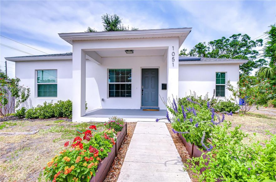 Available for annual lease starting July 1st -- Step into stylish Florida living with this newer-construction 3-bedroom, 2-bath home, built in 2022 and designed with both comfort and contemporary appeal in mind. Bathed in natural sunlight, this thoughtfully designed home features an open and inviting floor plan with clean lines and sleek black accents that add a bold modern touch. The heart of the home is the expansive living area that effortlessly flows into the dining space and kitchen—ideal for entertaining or everyday comfort. The kitchen is a standout with its large center island perfect for casual dining or meal prep, complemented by quartz countertops, custom cabinetry, and stainless-steel appliances that create a polished, gourmet feel. The split-bedroom layout offers privacy and functionality, with the primary suite tucked away on one side of the home. The suite features a generous walk-in closet and a beautifully designed en-suite bath with a large walk-in shower. The two additional bedrooms are bright and well-sized, each with ample closet space, and share a stylish hall bathroom with a tub and shower combo. Luxury vinyl plank flooring flows throughout the living spaces, while the bathrooms feature eye-catching designer tile. The side-entry 2-car garage offers added privacy and convenience, with direct access to the kitchen and laundry room—perfect for rainy days or bringing in groceries. Energy-conscious buyers will love the added bonus of solar panels on the roof, offering increased energy efficiency and reduced utility costs year-round. Located just minutes from vibrant Downtown St. Pete, the eclectic charm of Gulfport and the area's award-winning beaches, this home is perfectly situated. Hurry, schedule your appt to view today before it's gone!
