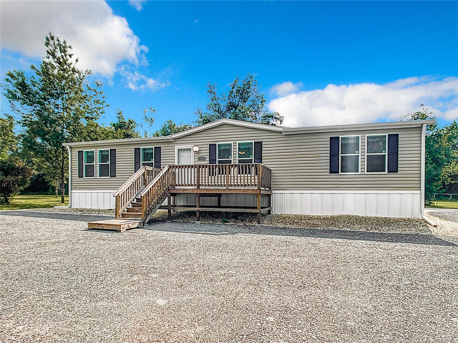 Location Location, Location! ALL FURNITURE INCLUDED WITH THE SALE OF THE HOME! Hard to find 5-acre corner lot. Paved road on 2 sides The property is tree lined and very private. 2023 Manufactured home. 3 bedrooms, 2 bath home with an office that could be used as an additional bedroom. Laminate flooring throughout. All appliances including washer and dryer. the kitchen is open, has plenty of cabinets, perfect for entertaining. Barn doors open up to the Master suite. Spectrum Internet available. The yard boasts a 12x24 shed and an 18x30 carport. Asphalt driveway and parking. Security cameras included as well. Parking for RV. Property is in close proximity to WEC, Black Prong, Hits and Goethe Forest. Close to the city of Williston with shopping, restaurants, banking and more. This beauty won't last long. Come take a look.