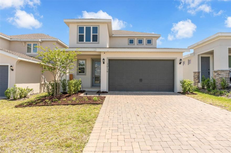 LIFESTYLE • LOCATION • CONVENIENCE! Don’t miss your opportunity to own this TURN-KEY home just steps away from community amenities in the highly sought-after HILLS OF MINNEOLA community. This thoughtfully planned neighborhood offers an active lifestyle, upscale amenities, and convenient access throughout Central Florida. The popular Magnolia floor plan by Dream Finders Homes features a stylish, functional open-concept design. From the moment you step into the elongated foyer, you’ll notice the attention to detail—vaulted ceilings, abundant natural light, custom wall trim, and luxurious tile flooring throughout the main living areas. This well-designed two-story home offers 4 bedrooms, 2.5 bathrooms, and flexible living spaces. The open-concept first floor seamlessly connects the family room, dining area, and kitchen—creating an ideal space for entertaining or everyday living. Sliding glass doors lead to a covered lanai overlooking peaceful greenery with NO REAR NEIGHBORS —perfect for outdoor dining, morning coffee, and relaxing under the Florida sky. The first-floor primary suite provides a private retreat, complete with a spa-inspired ensuite bath featuring dual vanities, a large walk-in shower, private water closet, and an oversized walk-in closet. The gourmet kitchen is designed to impress, showcasing a large island with custom trim, cooktop, 42” cabinets, designer zellige tile backsplash, stainless steel appliances with built-in oven, pantry, quartz countertops, and bar-top seating. Just off the kitchen, the laundry room offers additional cabinetry and storage with convenient access to the garage. Upstairs, you’ll find three spacious bedrooms and a versatile loft—perfect for a media room, playroom, home office, or additional lounge space. Surrounded by scenic rolling hills and natural beauty, Hills of Minneola offers a unique setting unlike many Central Florida communities—blending charm, comfort, and modern living in one exceptional location.  Ideally situated with easy access to Florida’s Turnpike, you’ll enjoy close proximity to local shops, restaurants, and the scenic Clermont Chain of Lakes—offering endless opportunities for dining, recreation, and outdoor living.
