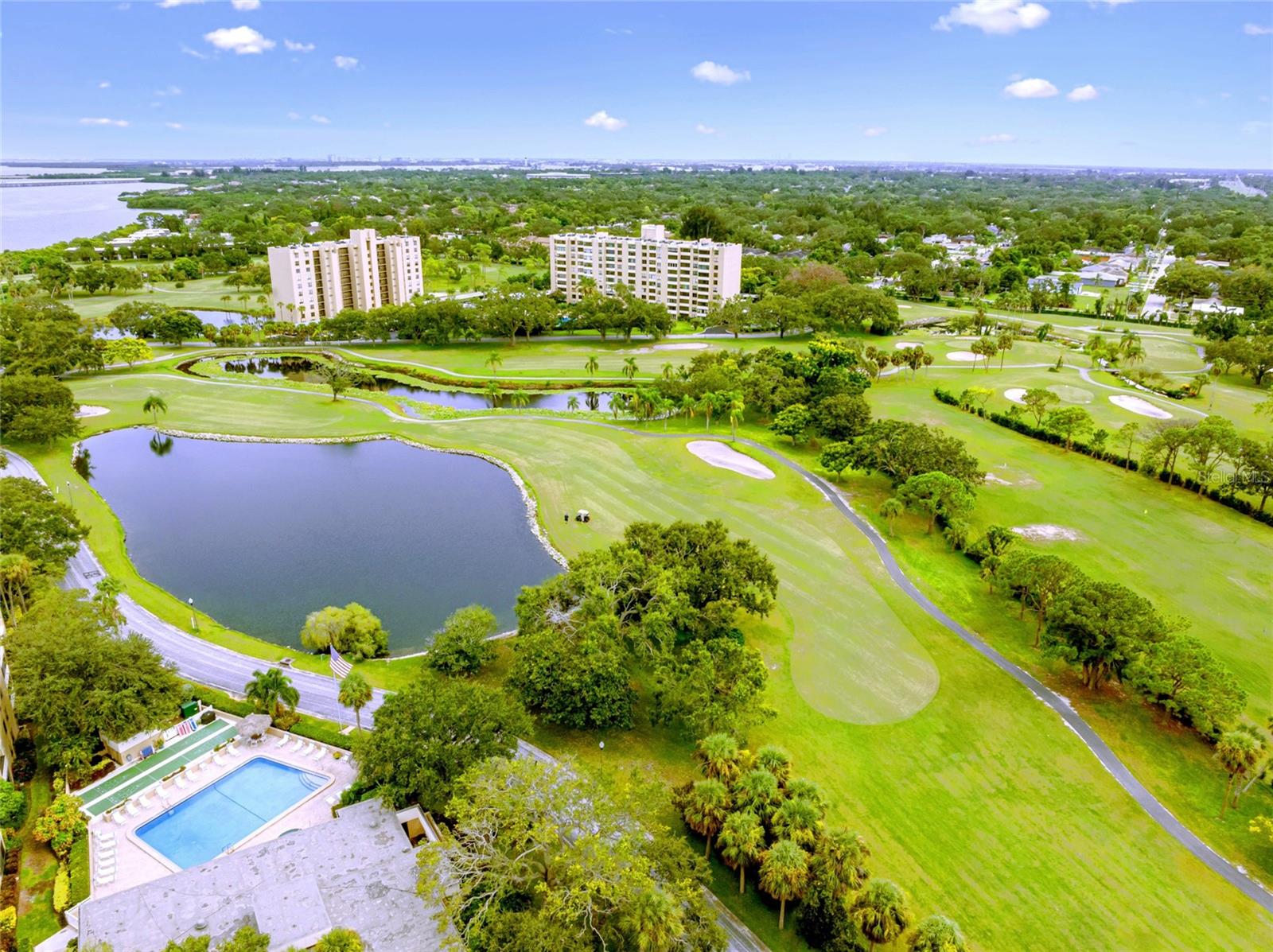 Enjoy million-dollar panoramic water views of Old Tampa Bay in this beautifully upgraded 2/2 fully furnished turnkey penthouse-level condo. Imagine living in a high-end condo where you are able to enjoy breathtaking views of beautiful Tampa Bay from the time you wake up until the end of the day. This is not a run-of-the-mill condo as it has an impressive list of features: it’s a penthouse-level corner unit condo with an amazing 1,250 square feet living area. There is a mesmerizing water view from all of the main rooms. The kitchen and both bathrooms have been upgraded. Spacious kitchen with ample counter space, an abundance of cabinets and stainless steel appliances. Hurricane impact windows throughout. There are 3 wall televisions; one is a Hulu TV which comes with Hulu. Brand new king-size (never-been-used) mattress and remote-controlled blinds in the primary bedroom. Tons of closet storage space throughout. Plank tile flooring. A high-efficiency water softener system. Your private laundry/storage room across the hall. The building has 2 elevators plus a trash chute. You will have your own covered parking space. Rent includes water, sewer, trash, basic cable. Sorry, no pets. Cove Cay is a golf community with a USGA rated 18-hole championship course with beautifully maintained greens meandering throughout the community. The community also has a marina where you can rent boats, jet skis, kayaks. AJ's Dockside Bar is a highly rated local favorite for fresh food, drinks and an overall good place to hang out. Cove Cay is a gated community with 24/7 security guards. You will have access to the clubhouse, heated pool, jacuzzi, fitness room, billiards. The location of Cove Cay is in the middle of everything! A short drive north is Dunedin, known for its vibrant downtown and Honeymoon Island, and Tarpon Springs, known for its Sponge Docks. A short drive east is the St. Petersburg Airport as well as Tampa and the Tampa Airport. Going south is St. Petersburg and it’s vibrant arts scene and downtown. Finally, going west, is the world renowned Clearwater Beach and the myriad of beaches along the coast. In between are restaurants, entertainment, activities, shopping, medical facilities, and more! If you’re looking for an amazing place to live and don’t want to settle for something ordinary and uninspiring, you need to check this condo out now before it’s gone!