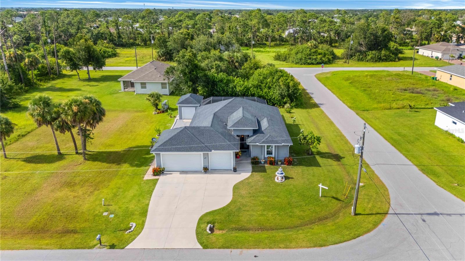 Welcome to your piece of paradise just a short drive from top destinations including Manasota Key, Boca Grande, and Gasparilla Island State Park. This Original Owner, Custom-Built home, was constructed with Luke Brother Homes and no expenses were spared. The home will NOT require flood insurance for those using a mortgage and the HOA fee is under $100/yr. Some of the upgrades you aren’t likely to find on other homes include GREEN LUMBER bug resistant roof trusses, SPRAY FOAM INSULATION throughout the entire attic keeping your power bill shockingly low, and 16 ceilings. This home is always prepared for storms with all windows, sliders, and doors being HURRICANE IMPACT RATED and owner upgraded UNDERGROUND UTITILIES. The property is located on an oversized corner lot at the near end of a cul-de-sac giving you plenty of privacy and features stunning curb appeal with mature landscaping. Once inside the home you will be captivated by the surprisingly tall ceilings, open layout, and instant views of the gorgeous kitchen and pool. The pavered lanai offers multiple areas to relax around your HEATED Pebble-Tech pool and also includes a HOT TUB and outdoor shower! The living room and dining room are both large enough to accommodate entertaining your family and friends and the entire home has tiled floors. The kitchen features granite countertops, solid wood cabinets with soft close doors/drawers, a built-in microwave, stainless steel range hood and a gorgeous tile backsplash along with a large pantry. The master suite was designed with storage space in mind and offers a unique solution to providing all the closet space you could want with a walk-through room that leads to the master bath. Once in the master bath you will notice a claw foot tub, a large walk-in tiled shower, and more storage thanks to the linen closet. The guest bedroom in the front of the home has a separate hallway door providing additional privacy and its own guest bathroom that matches the master bath. The 3rd bedroom has been converted to a hair studio complete with running water which could be converted to a wet bar if desired. As if the oversized 700+sqft garage wasn’t enough, the property also has an additional 20x12 Barn/Shed that matches the home including the shingle roof, block construction and garage door. Yes, you could fit a 4th car in here; or perhaps turn it into your own private office, home gym, or game room? The possibilities are endless. One-of-a-kind homes like this don’t come around often, contact your agent for a private showing today!!!