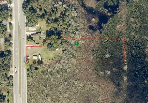 Prime 2.52-acre commercial lot on State Road 415 in Osteen, FL! This high-visibility location offers excellent frontage on a major thoroughfare. Positioned in a rapidly growing area, the property provides easy access to I-4, Sanford, and the East Coast beaches. Zoned for residential and commercial use, this vacant land is a great investment in a booming corridor.
The OMV zoning classification is designed to allow for a variety of residential and commercial uses along SR 415, supporting mixed-use development in accordance with the Osteen Local Plan. Permitted Uses: The zoning allows for single-family homes, townhomes, and multifamily residences alongside commercial uses such as retail, offices, medical clinics, restaurants, beauty salons, hotels/motels, and daycares.
Special Exceptions: Some uses, such as automobile service stations, bars, nightclubs, hospitals, and nursing homes, may require special approval.