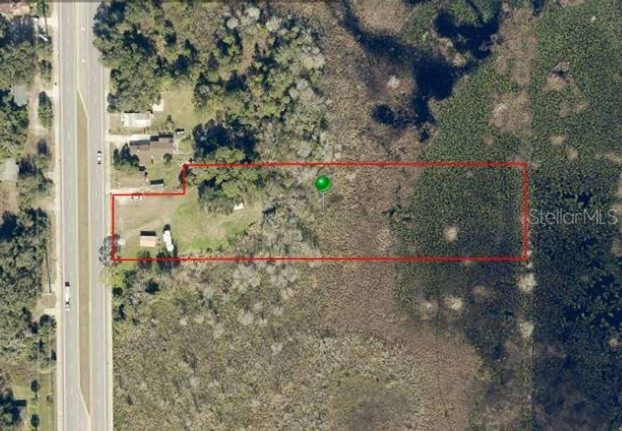 Prime 2.52-acre commercial lot on State Road 415 in Osteen, FL! This high-visibility location offers excellent frontage on a major thoroughfare. Positioned in a rapidly growing area, the property provides easy access to I-4, Sanford, and the East Coast beaches. Zoned for residential and commercial use, this vacant land is a great investment in a booming corridor. 

The OMV zoning classification is designed to allow for a variety of residential and commercial uses along SR 415, supporting mixed-use development in accordance with the Osteen Local Plan. Permitted Uses: The zoning allows for single-family homes, townhomes, and multifamily residences alongside commercial uses such as retail, offices, medical clinics, restaurants, beauty salons, hotels/motels, and daycares.

Special Exceptions: Some uses, such as automobile service stations, bars, nightclubs, hospitals, and nursing homes, may require special approval.