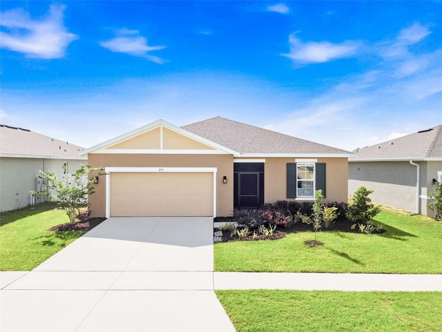 Welcome home to 253 Hilltop Bloom Dr in Haines City! This beautiful 4-bedroom, 3-bathroom home is better than new construction because everything is already done for you. No waiting around for unpredictable build times — just move right in and start living.

Step inside and you'll love the open floor plan that makes the whole place feel bright and spacious. The main living areas feature stylish tile flooring, while the bedrooms have cozy carpet underfoot. Window coverings are already installed throughout, so that's one less thing on your to-do list.

The kitchen is a real standout with white wood cabinets, gorgeous quartz countertops, and stainless steel appliances. It's the kind of space that makes cooking and hanging out feel effortless. The large living room flows right out to a screened porch, giving you the perfect spot to relax and enjoy your oversized fenced backyard. Great for kids, pets, or just having your own private outdoor retreat.

You'll find a spacious primary suite along with a junior suite that comes with its own private bath — super convenient for guests or older kids who want their own space. Two additional bedrooms round out the home, and there's a handy 2-car garage for parking and storage.

Location is a huge bonus here. You're close to the new Target shopping center, just minutes from Port 27, and a new toll road is coming soon for even easier access. Don't miss this one!