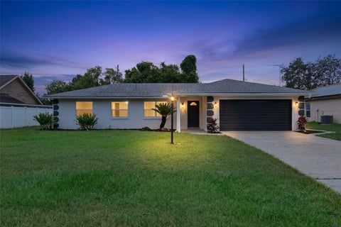 Photo of 1102 Magdalena Avenue, Deltona, FL 32725 (MLS # O6439642)