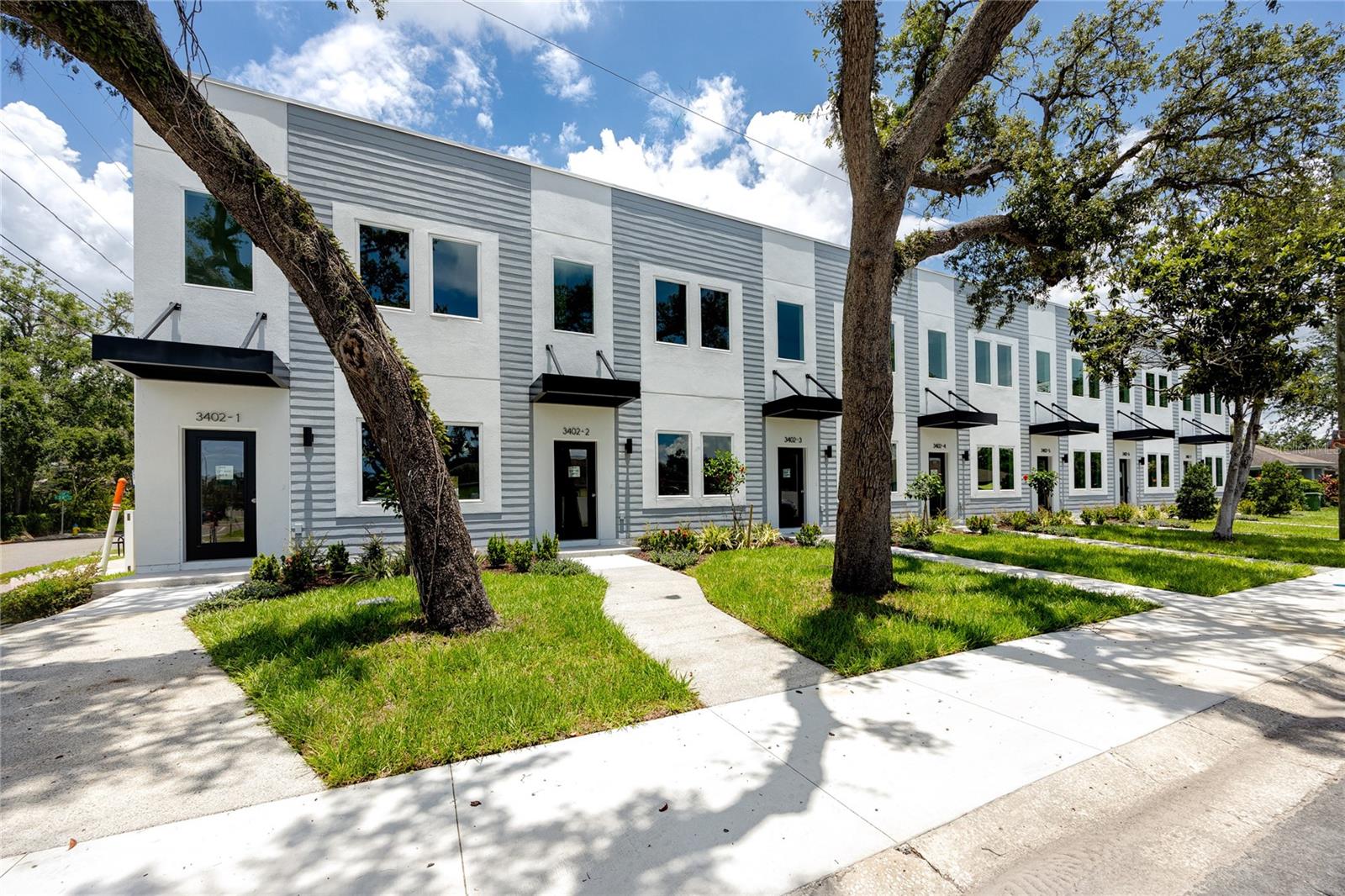 One or more photo(s) has been virtually staged. Ready to move in today! Experience modern elegance and unbeatable urban convenience in this brand-new, thoughtfully designed townhome. Offering 3 spacious bedrooms and 3 stylish bathrooms, this home is perfectly located just moments from downtown Tampa. The gourmet kitchen is a true showstopper, boasting custom flat-panel cabinetry, gleaming quartz countertops, stainless steel appliances, designer tile backsplash, and a chic breakfast bar—perfect for culinary adventures and effortless entertaining. Looking for flexibility? The downstairs bedroom transforms easily into a home office, creative space, or cozy retreat, while both upstairs bedrooms come with private en-suite baths for ultimate comfort. Step outside and unwind on your private fenced-in patio, just off the back door—the perfect spot to enjoy morning coffee or relax after a long day. Designed with sustainability at heart, this eco-friendly, green-certified home helps lower utility costs while promoting a smart, energy-efficient lifestyle. Plus, enjoy peace of mind with a 2-10 builder warranty, ensuring lasting quality. Minutes from Tamps's best attractions, including Y'bor, Armature Works, Ulele Restaurant, Water Works Park, Straz Performing Arts Center, Museum of Art, Glazer Museum, Curtis Hixon Waterfront Park, and a vibrant selection of restaurants and bars. Plus, enjoy quick access to the Selmon Expressway, I-275, and I-4.