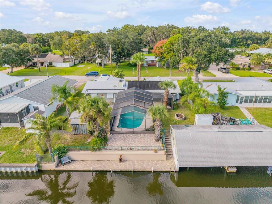 One or more photo(s) has been virtually staged. Affordable Waterfront Living on a Saltwater Canal — Minutes from the Intracoastal!

Enjoy the Florida lifestyle without breaking the bank! This 3-bedroom, 2-bath single-story home at 164 Azalea Rd in Edgewater offers direct canalfront access and is just minutes from the Intracoastal Waterway—perfect for boating, kayaking, fishing, or simply relaxing by the water.

Inside, the home feels bright and inviting, with natural morning light filling the open living areas. Featuring approximately 1,780 sq ft, tile flooring, a cozy fireplace, and a flowing layout, it’s ideal for comfortable everyday living. Recent updates include a new HVAC system and new siding, keeping maintenance low and life easy.

The 9,000 sq ft lot leads directly to your private boathouse, ready for launching a kayak, enjoying quiet evenings, or watching the tide roll in. With city water, septic, high-speed internet, and no HOA, you get simple, stress-free waterfront living.

Located close to schools, just minutes from US-1 and I-95, and a short drive to the river, this property offers Intracoastal lifestyle at an incredible value. Don’t miss your chance—schedule a private tour today!