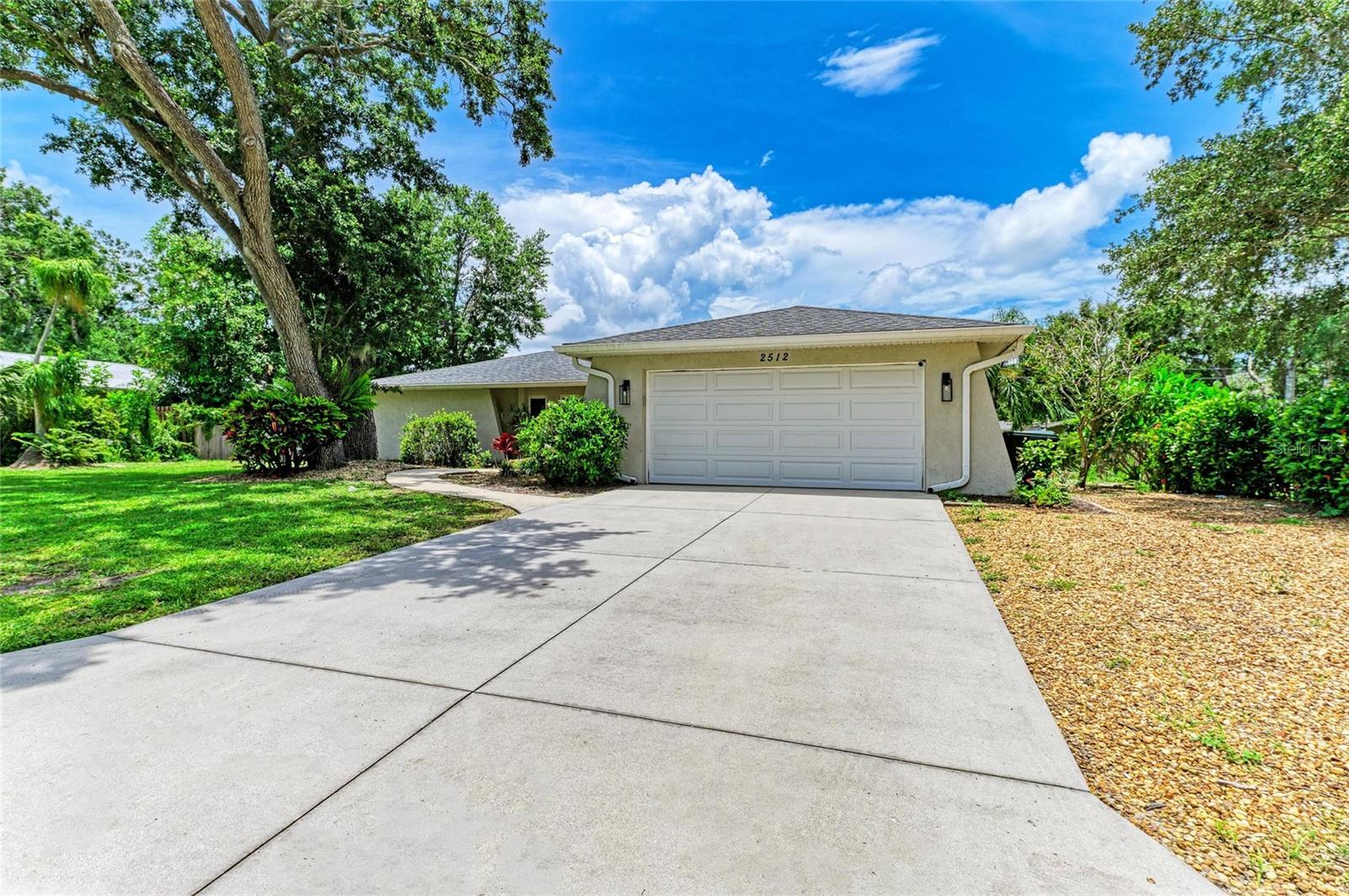 Peace and tranquility await in this beautifully updated 3-bedroom, 2-bath home, nestled on a quiet cul-de-sac just 10 minutes from Siesta Key Beach and 15 minutes from downtown Sarasota. Step inside to find a renovated kitchen, new AC and water heater, brand new flooring in the living and dining rooms, and a freshly updated bathroom shower. The split floor plan offers large bedrooms and privacy, while the spacious screened lanai and generous yard provide the perfect setting for outdoor living—with plenty of space to add a pool. With no HOA, there’s room for your boat, RV, or other toys. Conveniently located near schools, shopping, and dining, this move-in ready home is truly a rare find!