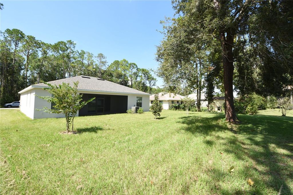 Photo of 102 Brittany Lane, Palm Coast, FL 32137 (MLS # FC317891)