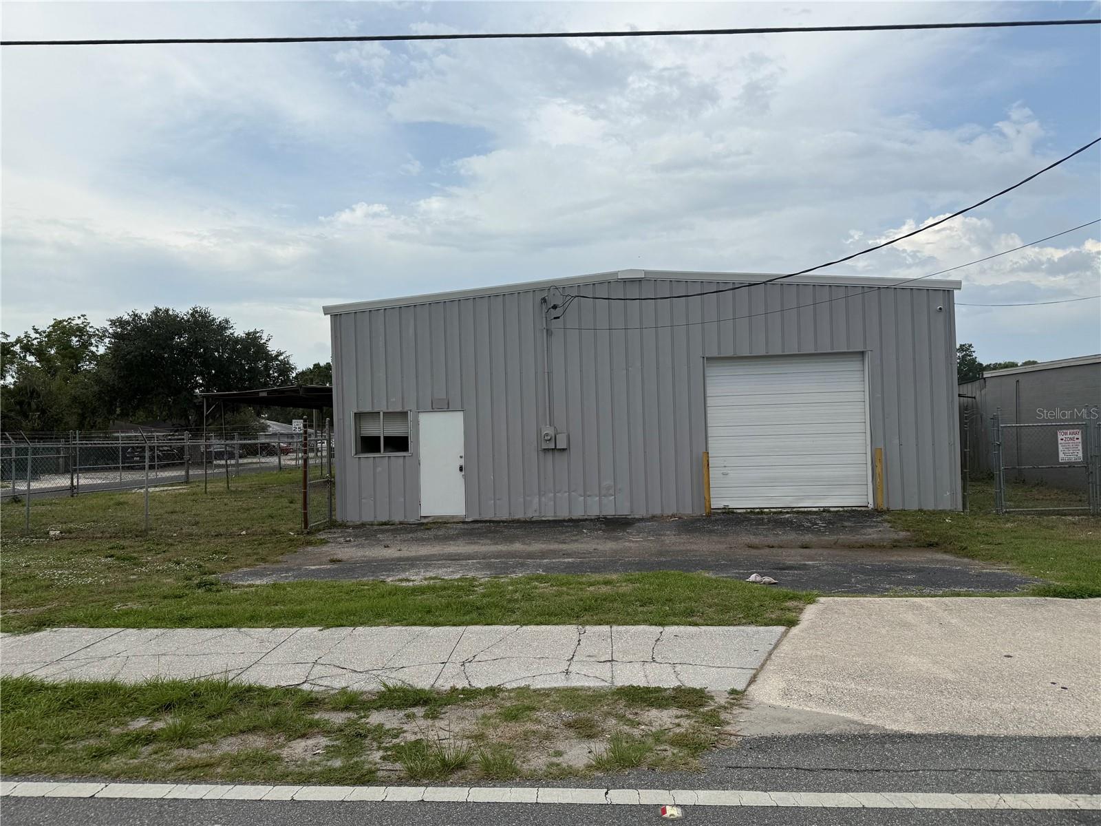 Unlock the full potential of this expansive and highly versatile commercial property! Boasting over 4800 sq. ft. of industrial space and office
space this facility is designed for adaptability—with three professional office suites, five overhead doors (three 10’ and two 14’), and a secure fenced yard ideal for equipment or fleet storage. An additional space with 10’ overhead door and Olive Street frontage adds even more flexibility and exposure. Whether you’re an investor, builder, or business owner, this property offers nearly limitless applications—from light industrial and warehousing to service operations and distribution. Rare find with unmatched functionality!