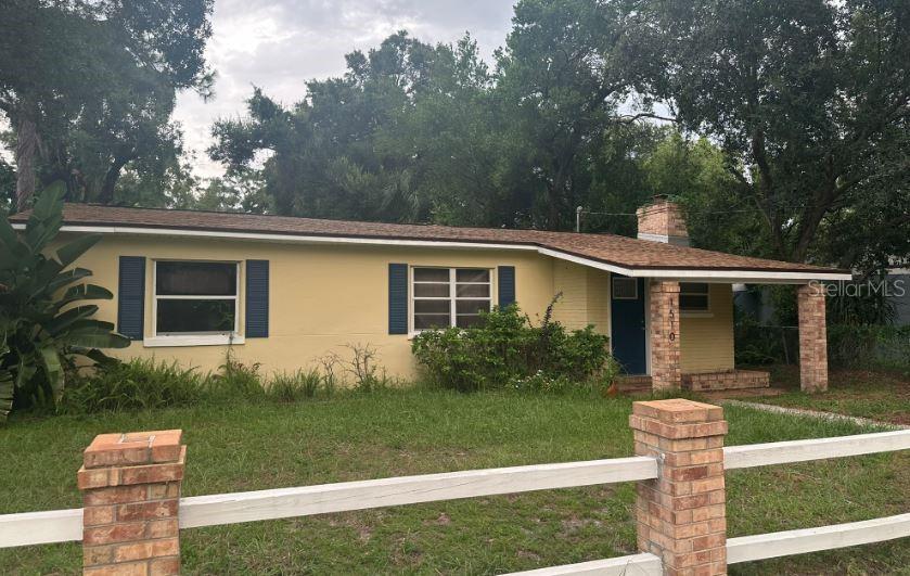 Charming 1950s Home in Southeast Seminole Heights
Welcome to this delightful one-story home tucked away on a peaceful street in Southeast Seminole Heights. Set back from the road on a spacious, lushly landscaped lot, this 1950s gem blends vintage charm with modern convenience.
Step inside to a welcoming flex space featuring a cozy fireplace—ideal for a home office, reading nook, or entertaining guests. Toward the back of the home, you'll find a generously sized laundry room with plenty of storage.
To the left of the entryway, a bright and airy living and dining area flows seamlessly into the kitchen, allowing you to stay connected with family and friends while you cook. French doors just off the dining room open into the expansive master suite, complete with vaulted ceilings, abundant natural light, a second fireplace, a large walk-in closet, and a spacious en suite bathroom.
Two additional bedrooms are located on the opposite side of the home, offering added privacy and comfort for guests or family. They share a beautifully updated full bathroom.
Outside, enjoy a fully fenced backyard perfect for outdoor living, plus a detached block shed for extra storage.
This home offers the perfect mix of space, character, and location—don't miss your chance to enjoy the best of Southeast Seminole Heights living!