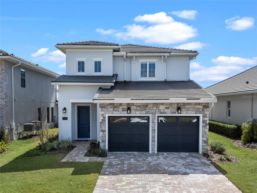 Experience luxury living in the Milan floor plan by Dream Finders Homes, offering stunning, unobstructed golf course views in the exclusive Bella Collina community. Featured in Orlando’s Parade of Homes, this 4-bed, 3.5-bath residence boasts over 2,800 sq. ft. of thoughtfully designed living space and is a pristine, unlived-in model home with no wear and tear—ready for its first owner!

The open floor plan features a gourmet kitchen with premium cabinetry, high-end appliances, a natural gas stove, and a striking waterfall island...perfect for entertaining. Expansive windows fill the home with natural light, showcasing the breathtaking golf course views. The downstairs primary suite is a private retreat, featuring a spa-like bath with a freestanding tub, dual shower heads, and a walk-in shower.

Designed for indoor-outdoor living, the covered lanai is pre-plumbed for a summer kitchen and offers ample space for a future pool. Enjoy resort-style amenities, including the championship 18-hole golf course designed by Sir Nick Faldo, tennis and pickleball courts, a fitness center, full-service spa, and the 19th Hole restaurant—perfect for dining after a round of golf.

Conveniently located near Montverde Academy, Disney, the Florida Turnpike, FL 429, shopping, restaurants, entertainment, and hospitals, this home offers the epitome of convenience and sophistication. With 24-hour manned security, this exceptional home offers privacy, exclusivity, and an unmatched lifestyle. Don’t miss this opportunity—schedule your private tour today!